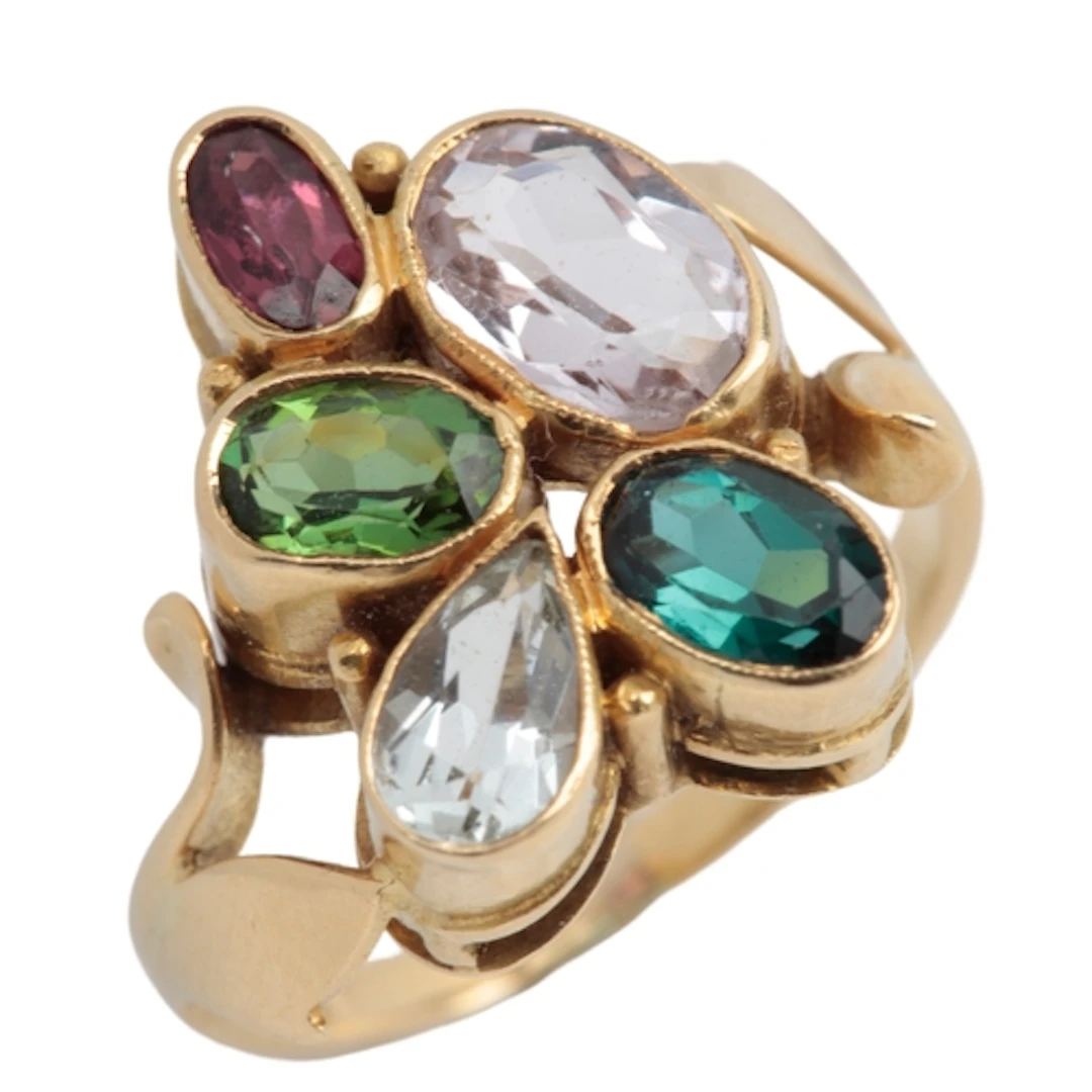 A multi-gem ring, circa 1965, collet-set with oval and pear-...