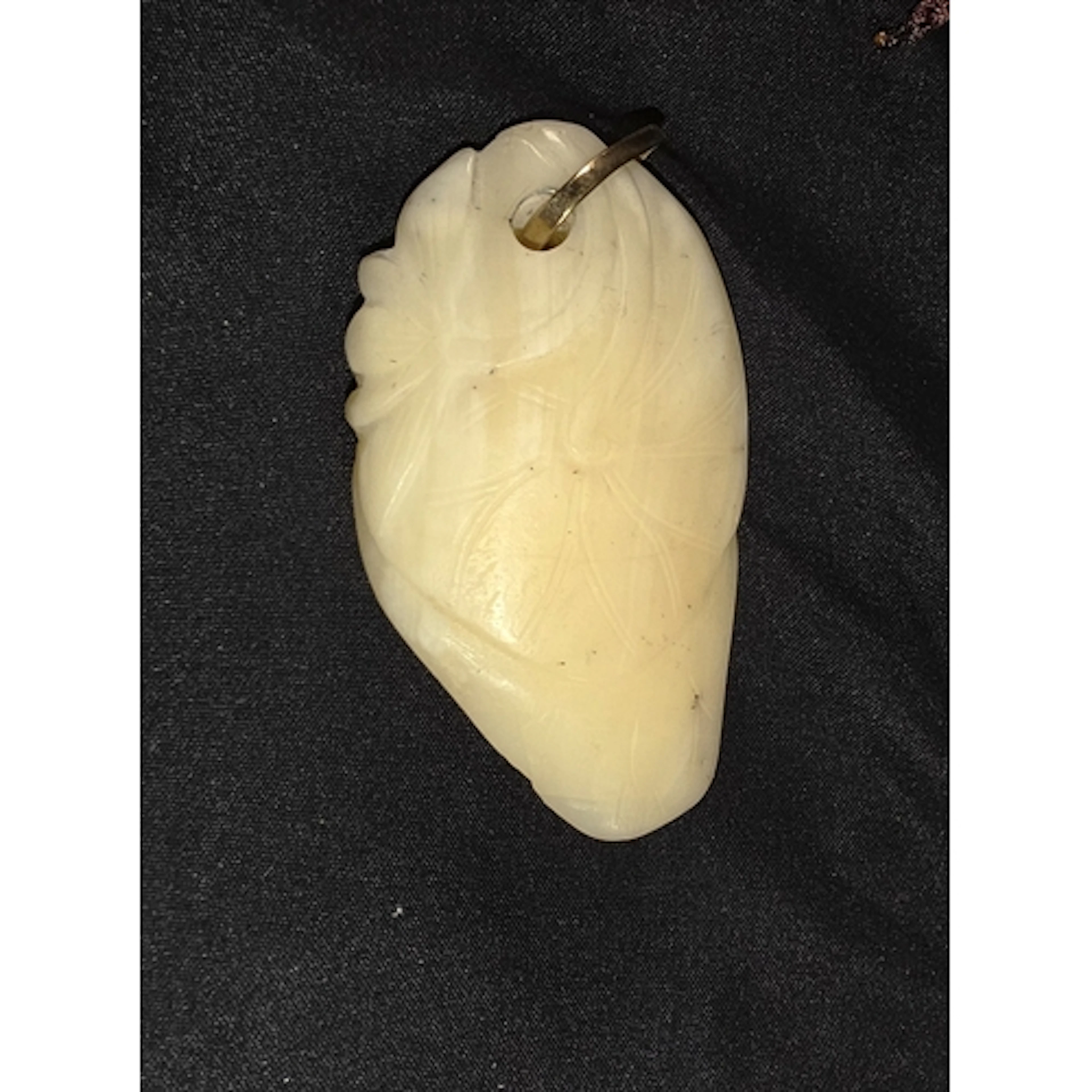 A Chinese 19th century white jade carving of lotus leaf and ...