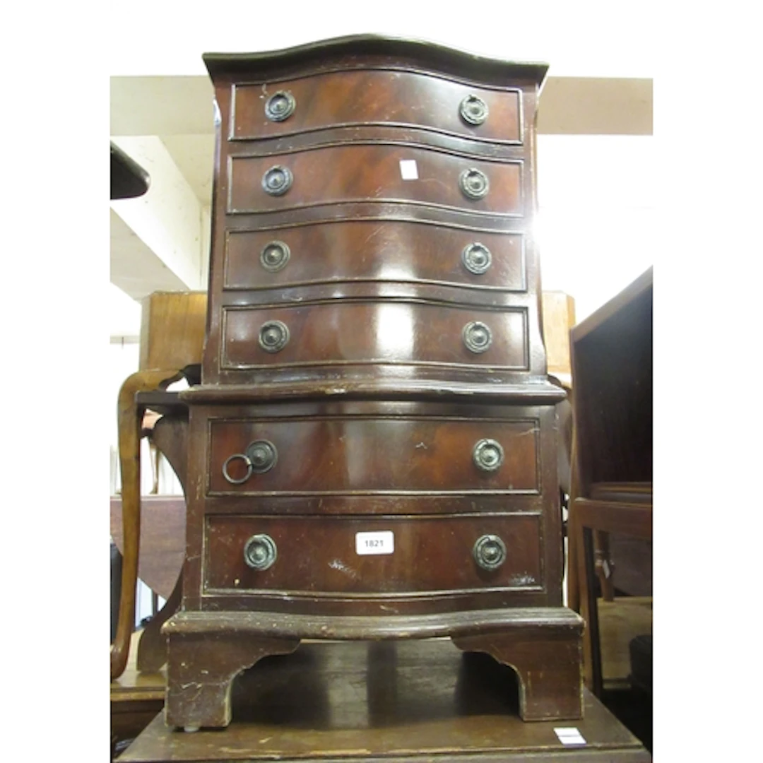 Reproduction mahogany serpentine fronted bedside chest, of s...
