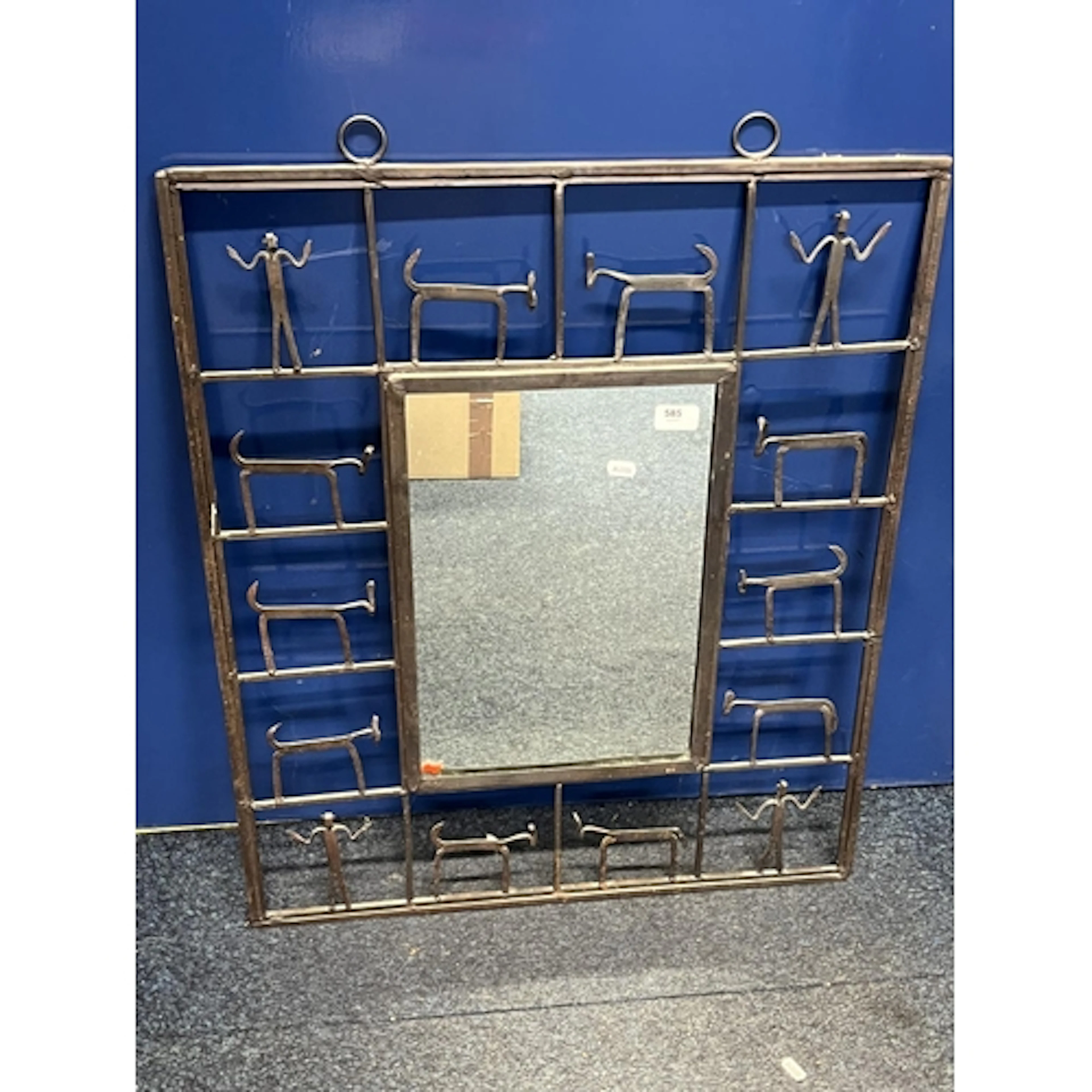 African Folk Art metal wall mirror, having depictions of ani...