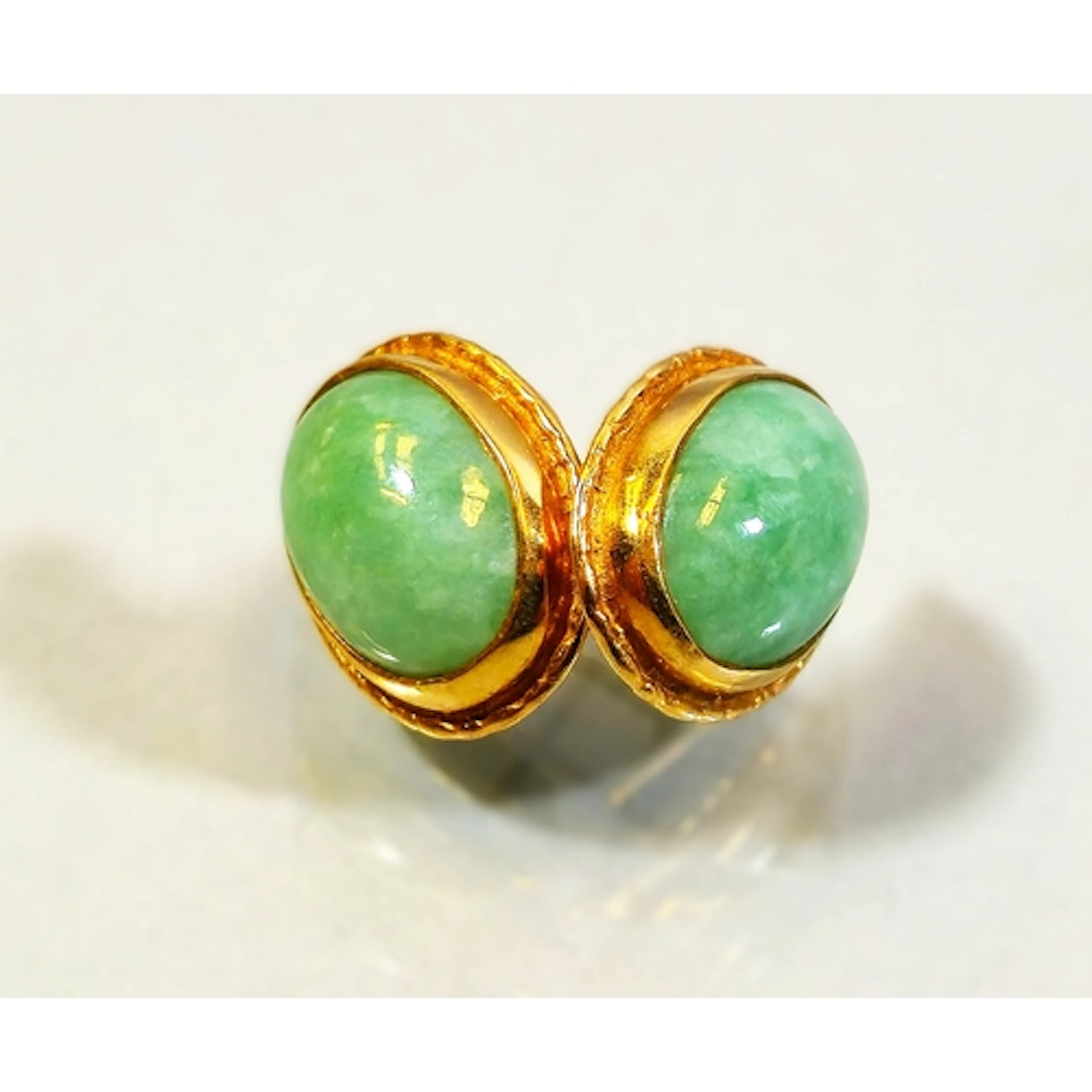 Pair of 9ct gold and green jade earrings, set with a raised ...