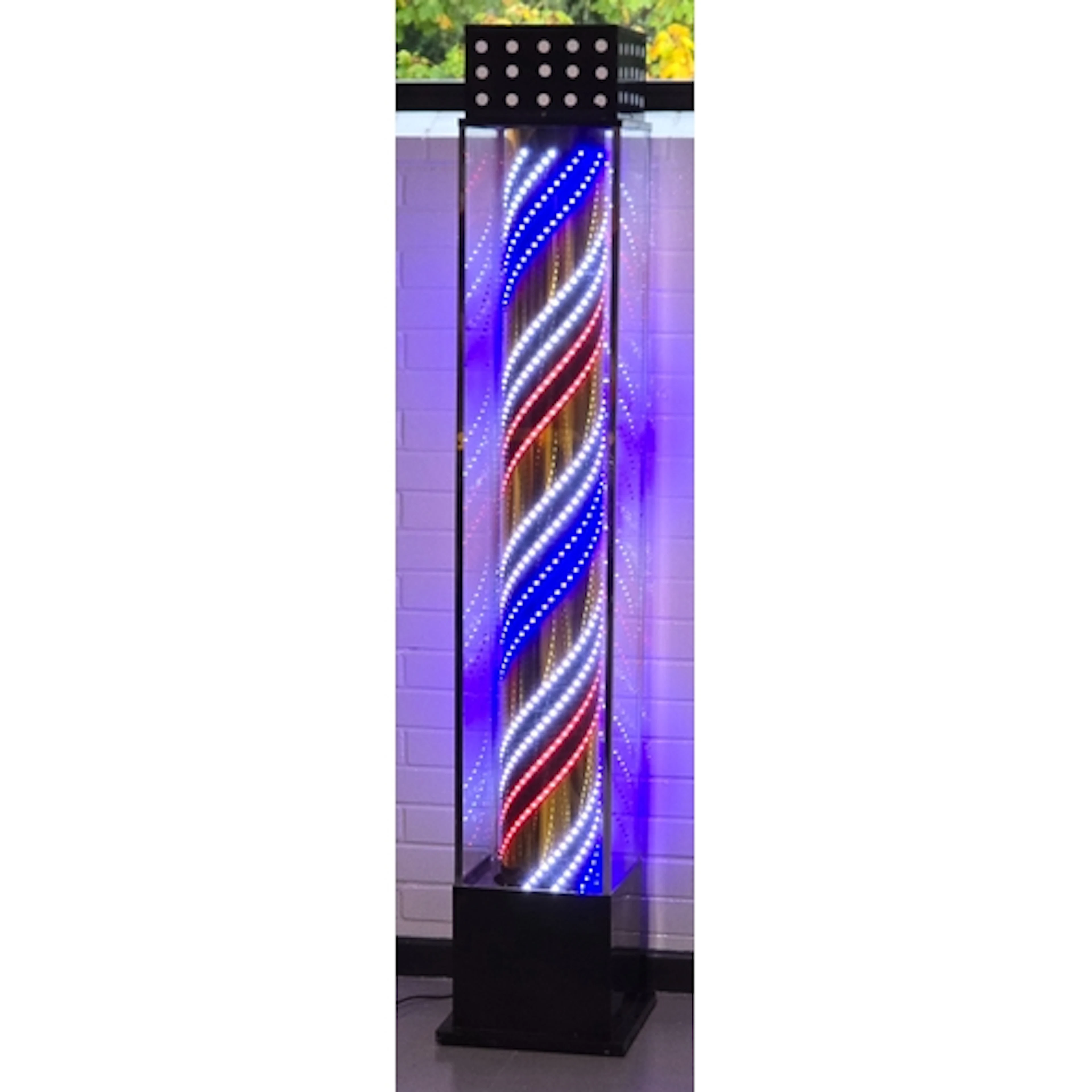A large contemporary floor standing LED barbers pole. Measur...