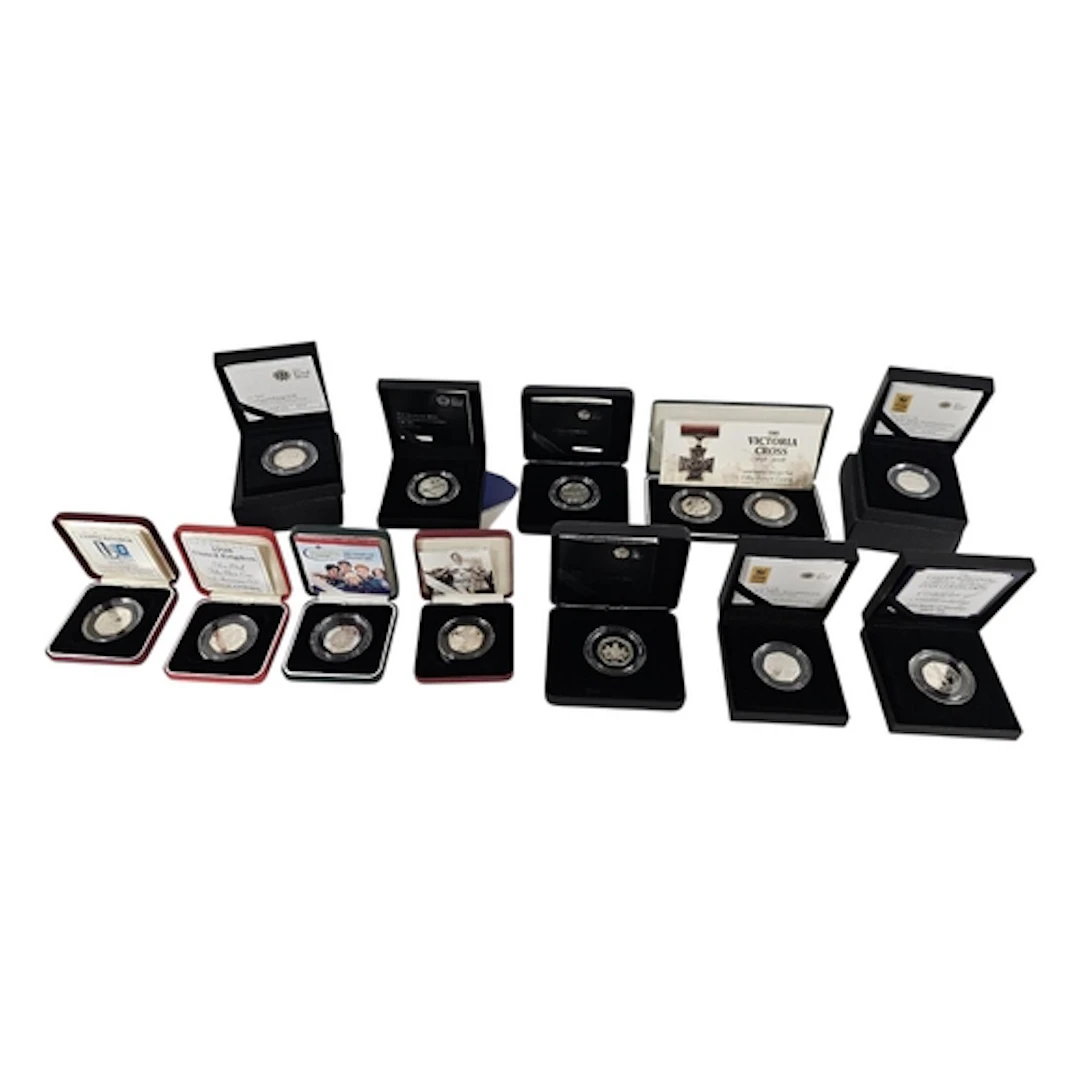 A COLLECTION OF TWELVE COMMEMORATIVE SILVER PROOF FIFTY PENC...