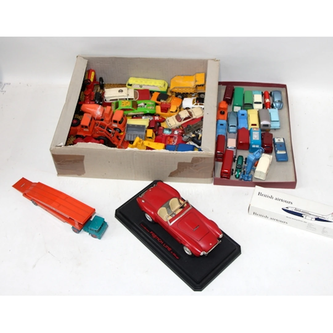 Two trays of loose vintage die-cast model vehicles. Some goo...