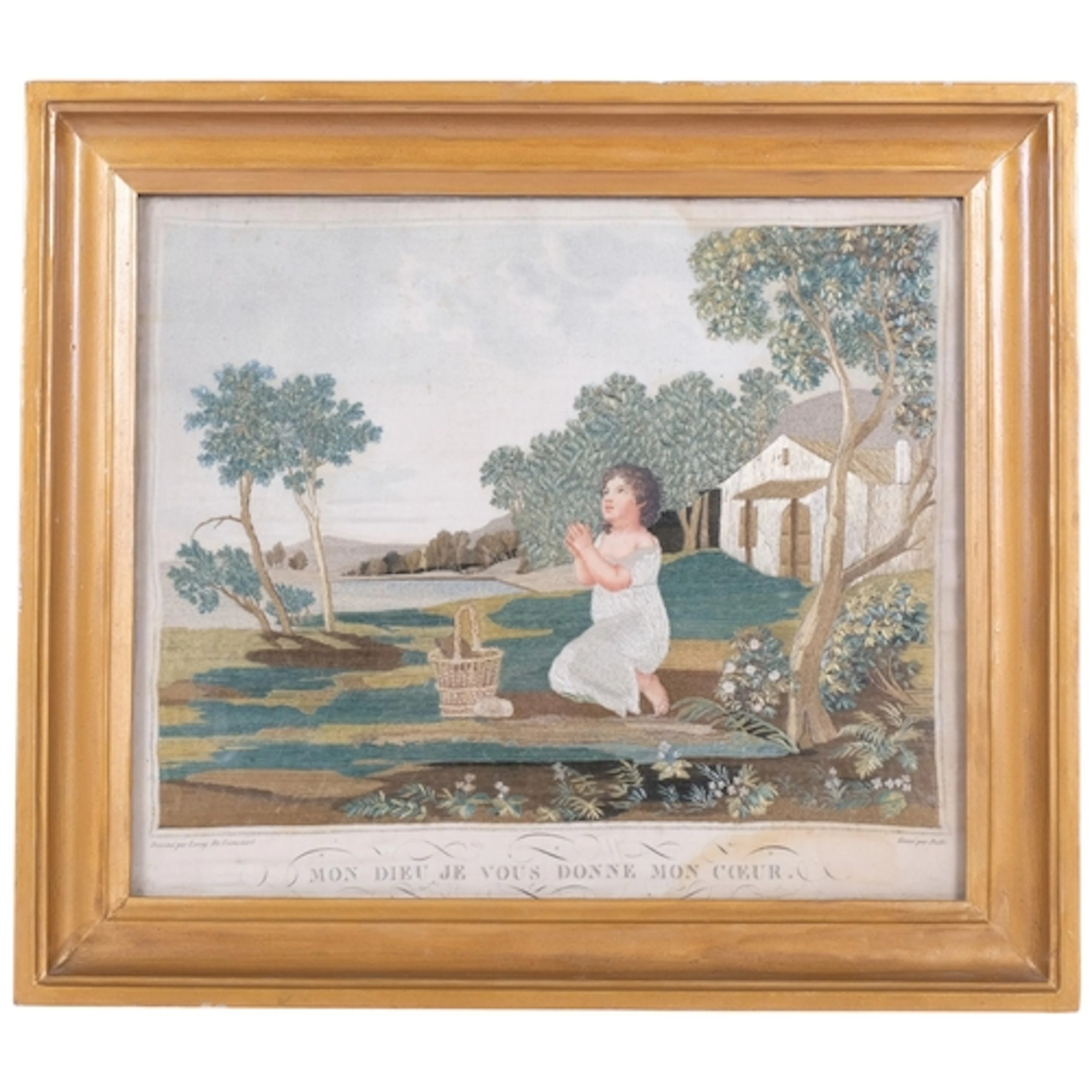 A 19th century gilt-framed hand embroidery on silk child pra...