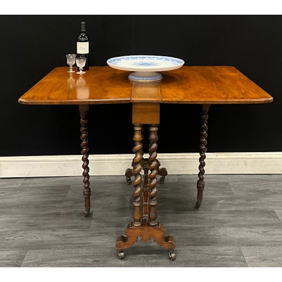 A Victorian walnut Sutherland table, rectangular top with ro...