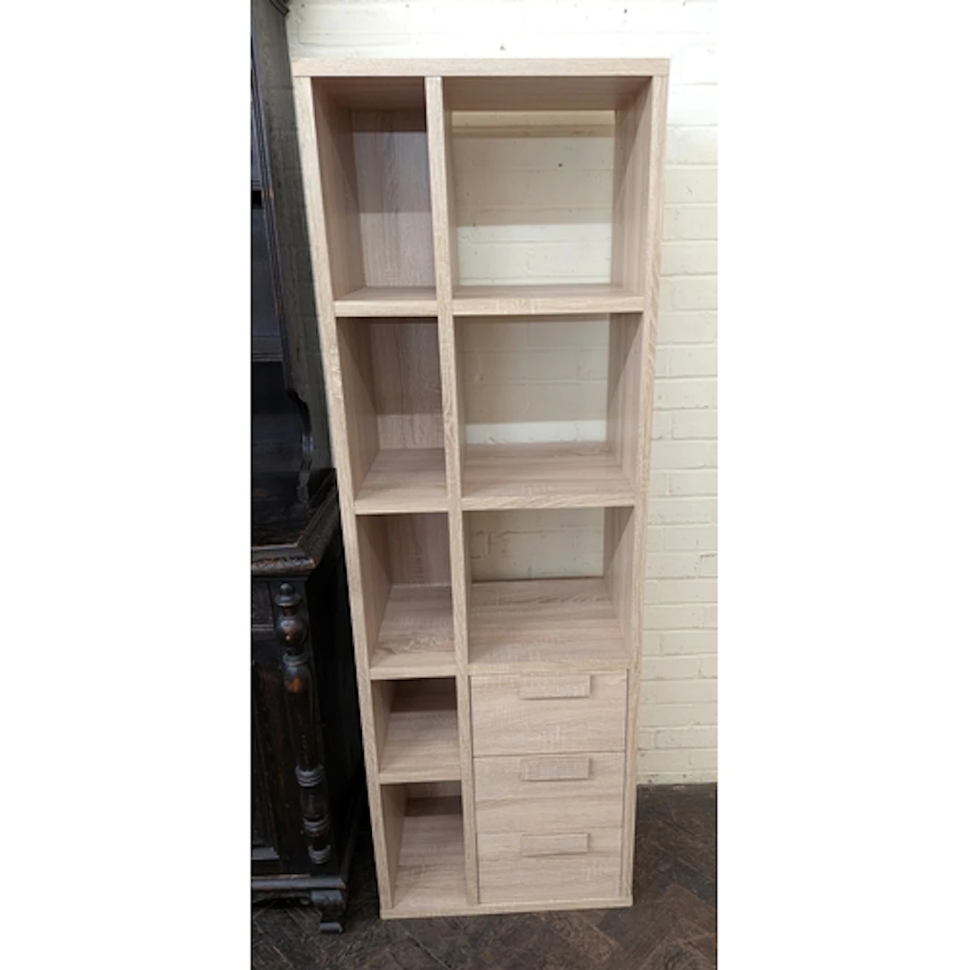 A modern limed oak effect storage unit of cubed shelves and ...