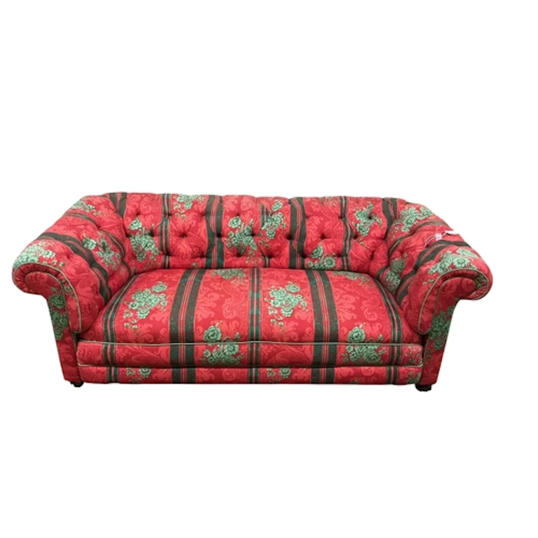 An early 20th century Chesterfield settee upholstered in but...