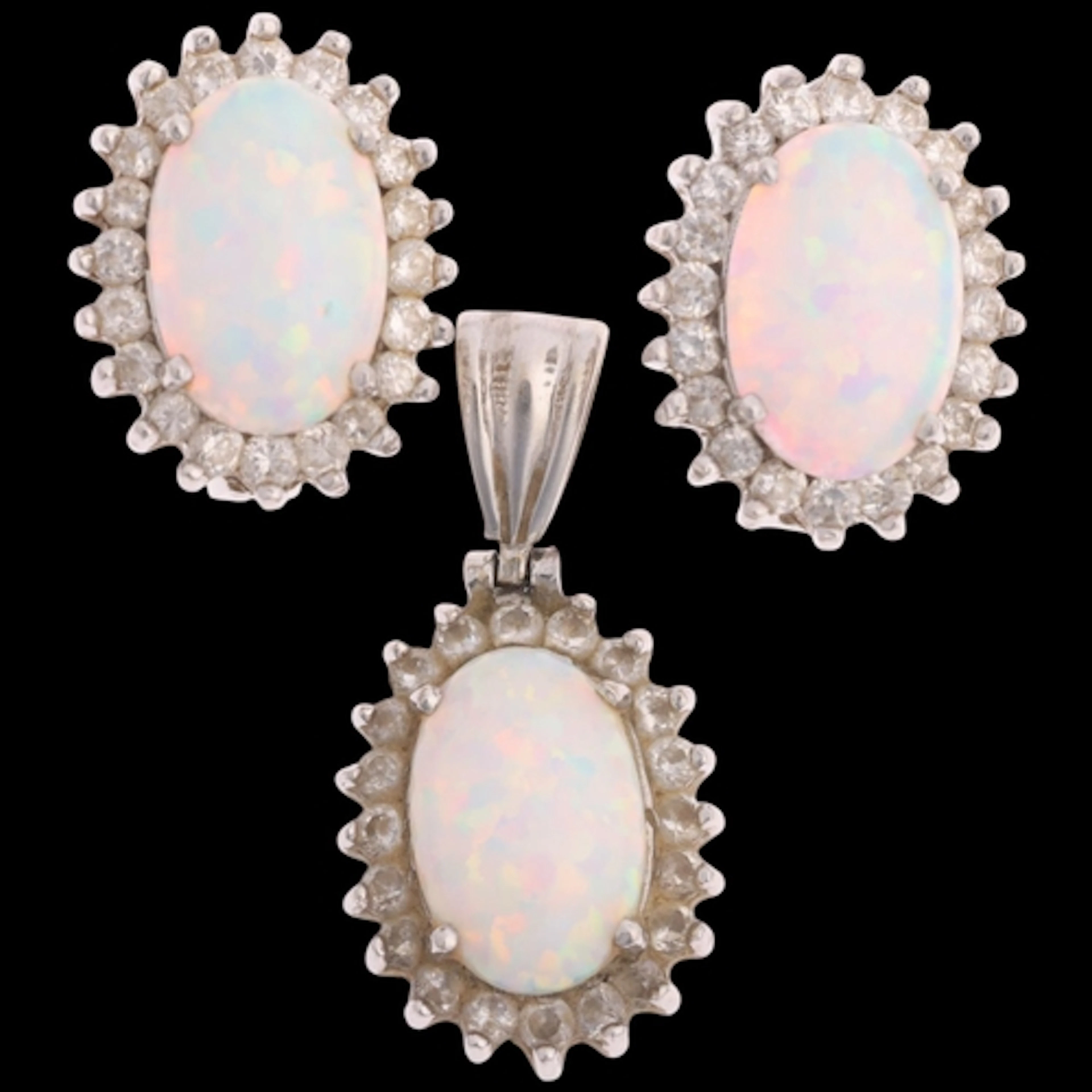 A 14ct white gold synthetic opal and cubic zirconia cluster ...