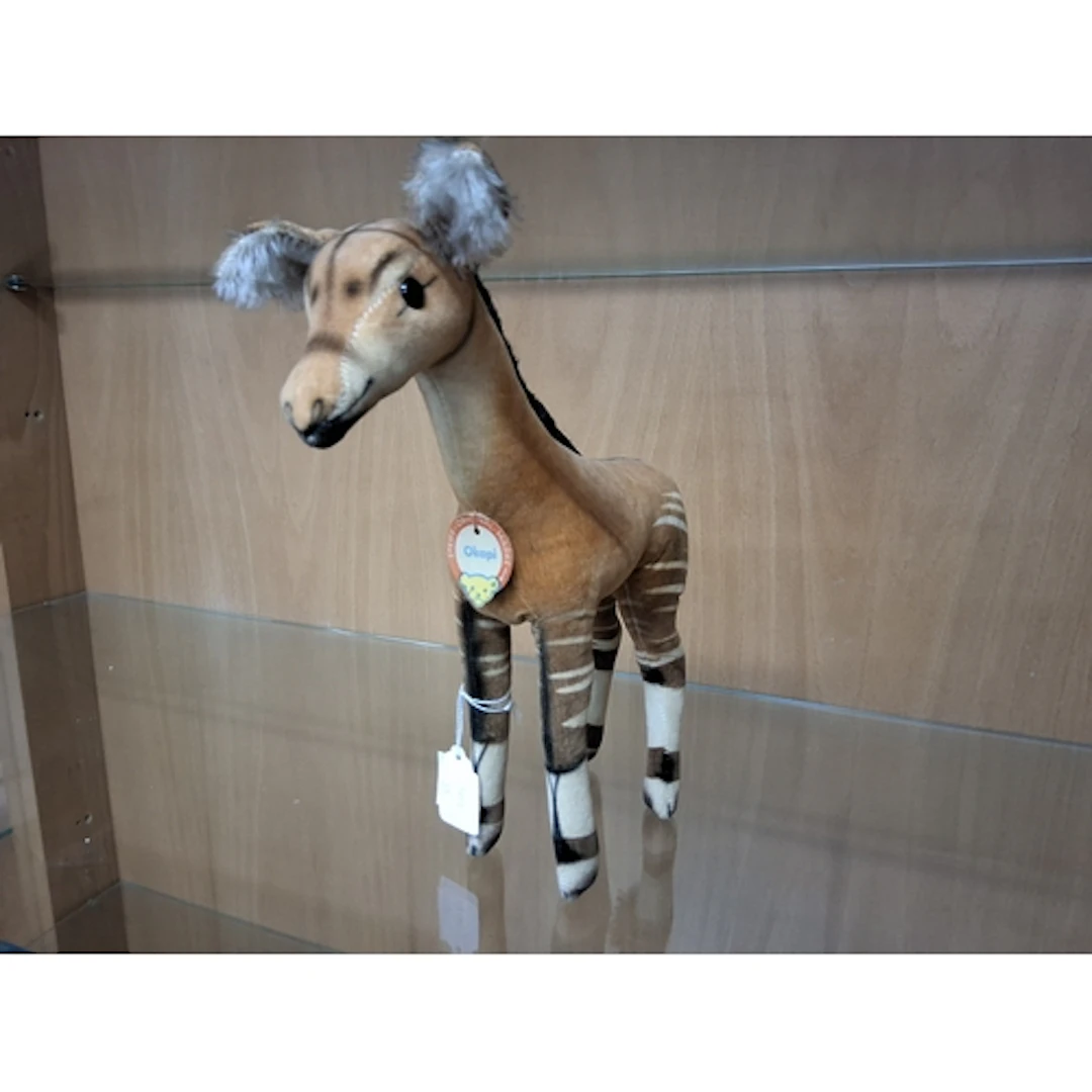 A VINTAGE STEIFF OKAPI TOY with glass eyes, swing tag to the...