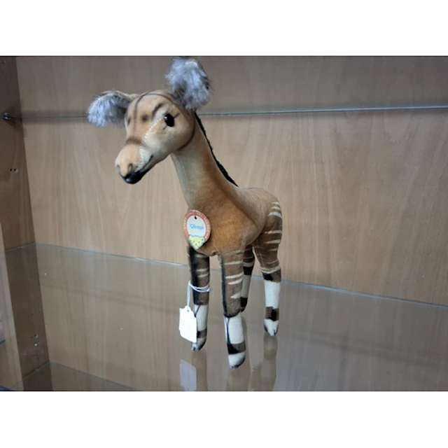 A VINTAGE STEIFF OKAPI TOY with glass eyes, swing tag to the...