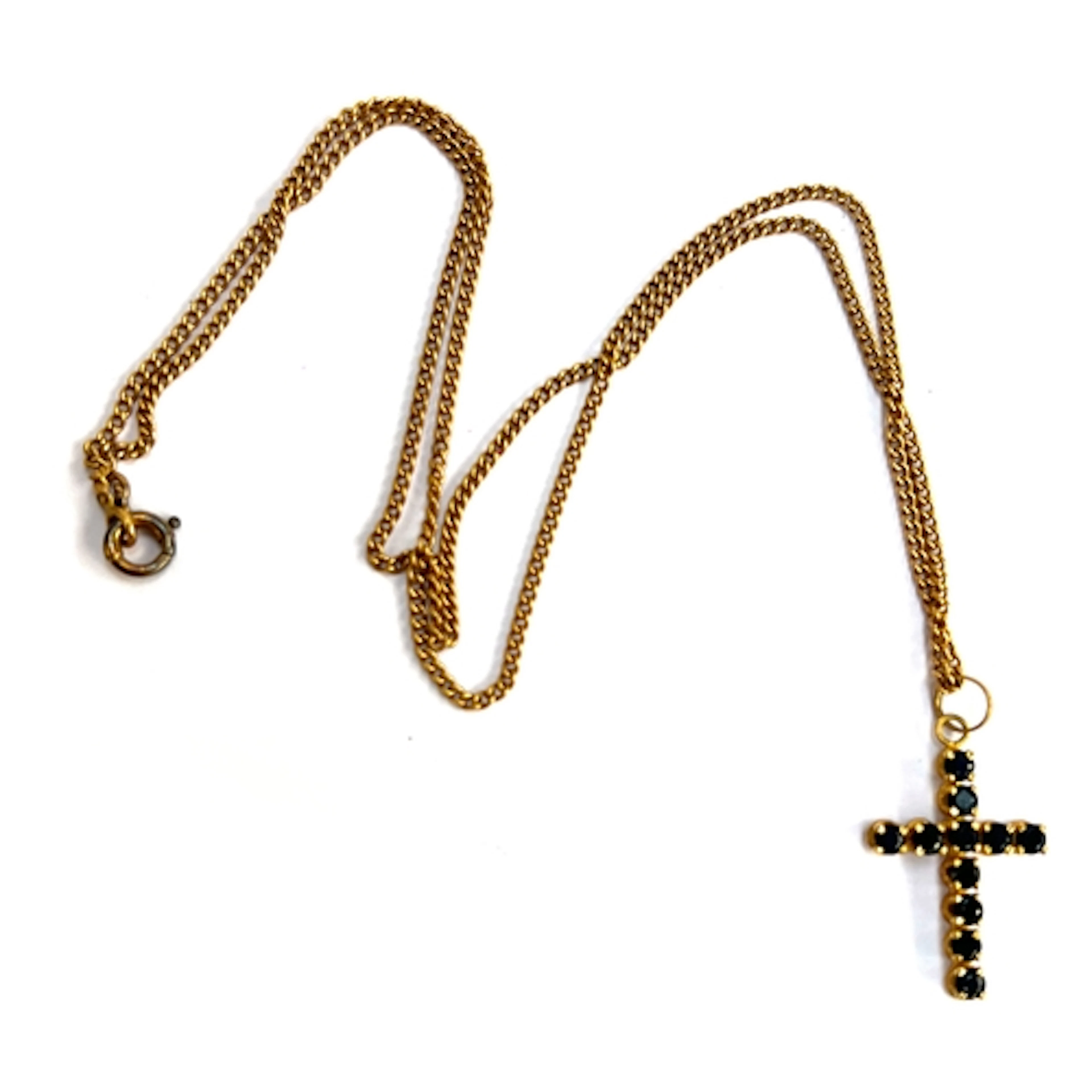 A 9ct gold sapphire crucifix on a gold chain, 5.6g