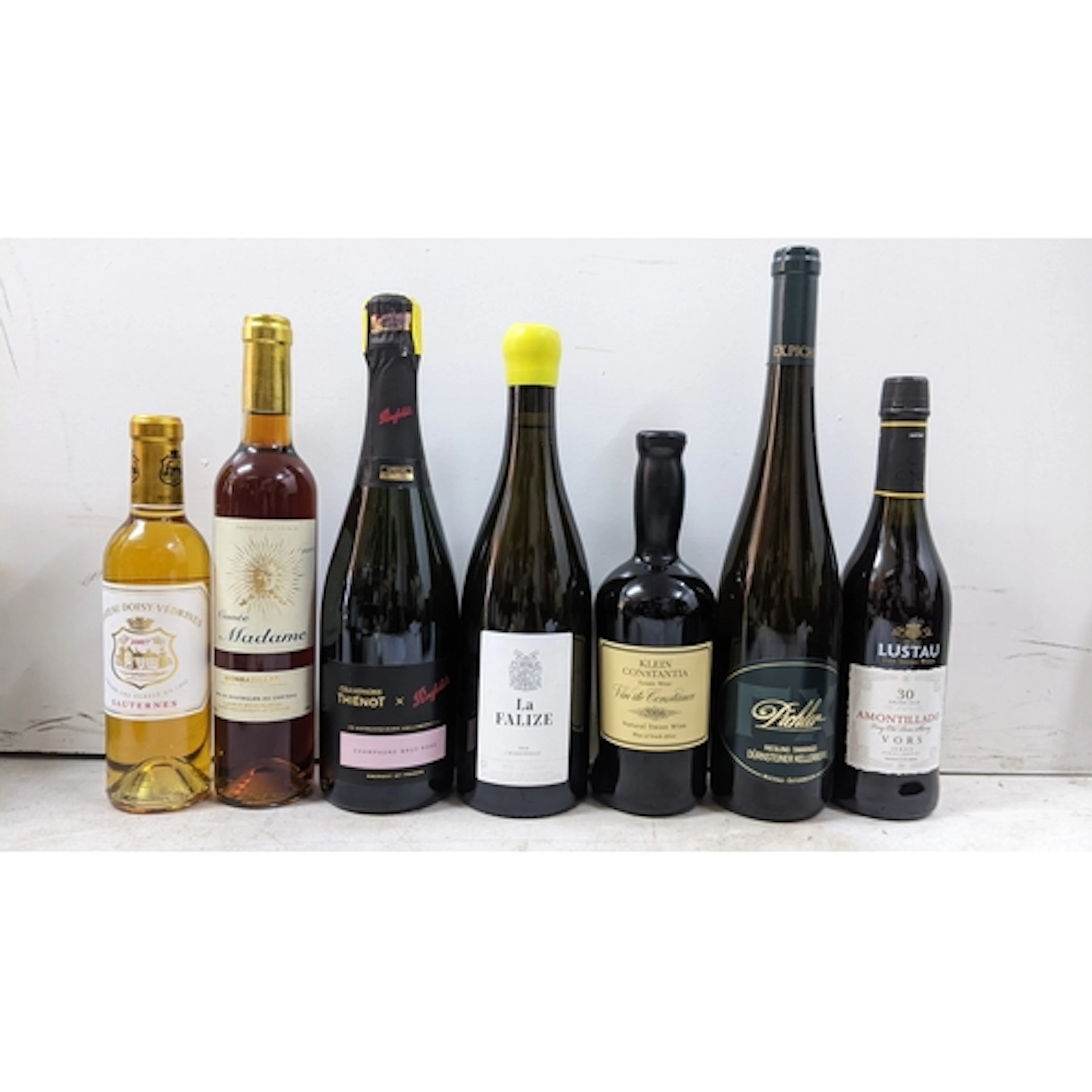 A group of six bottles of dessert and fortified wine, compri...