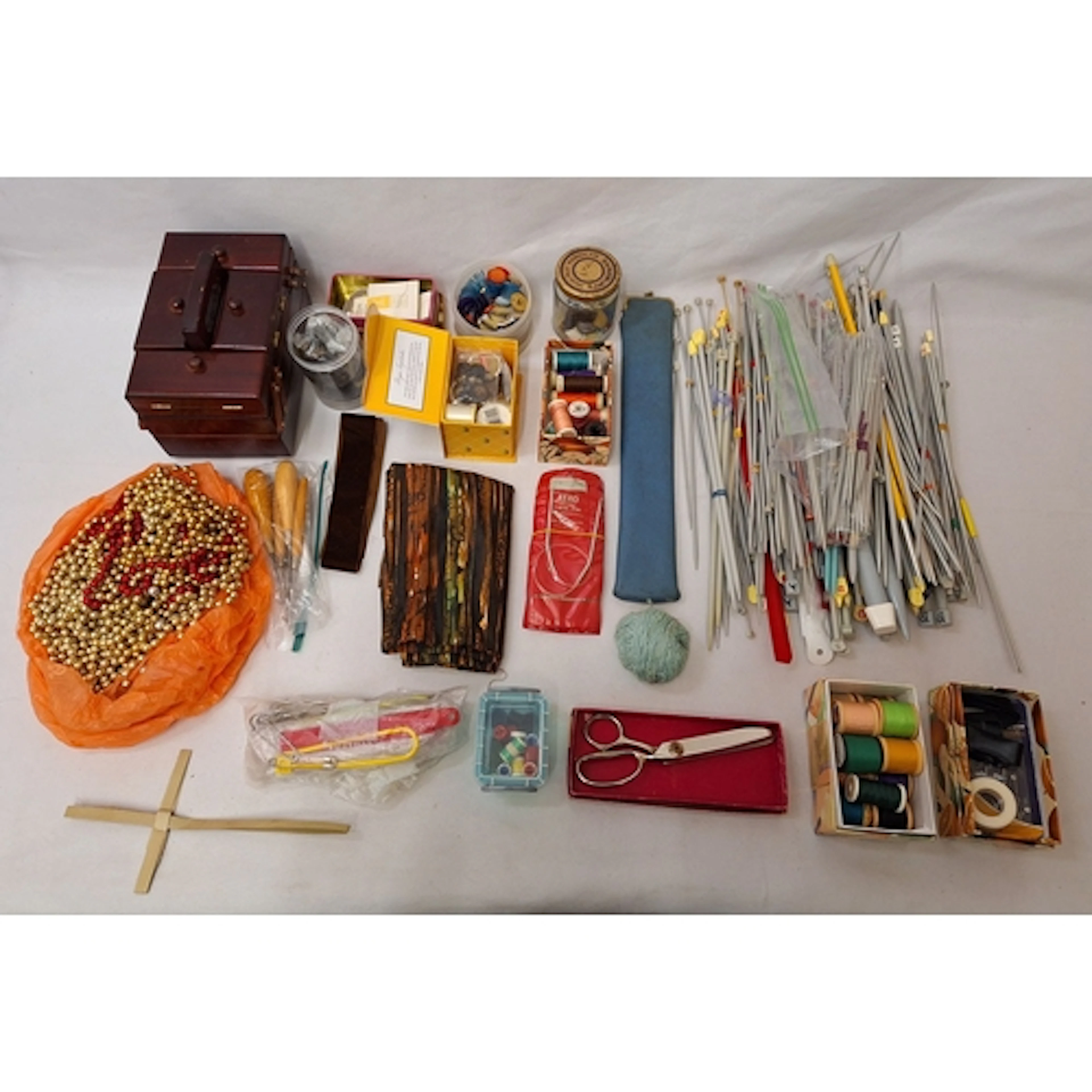 Buttons, pinking shears, knitting needles, reels of cotton, ...