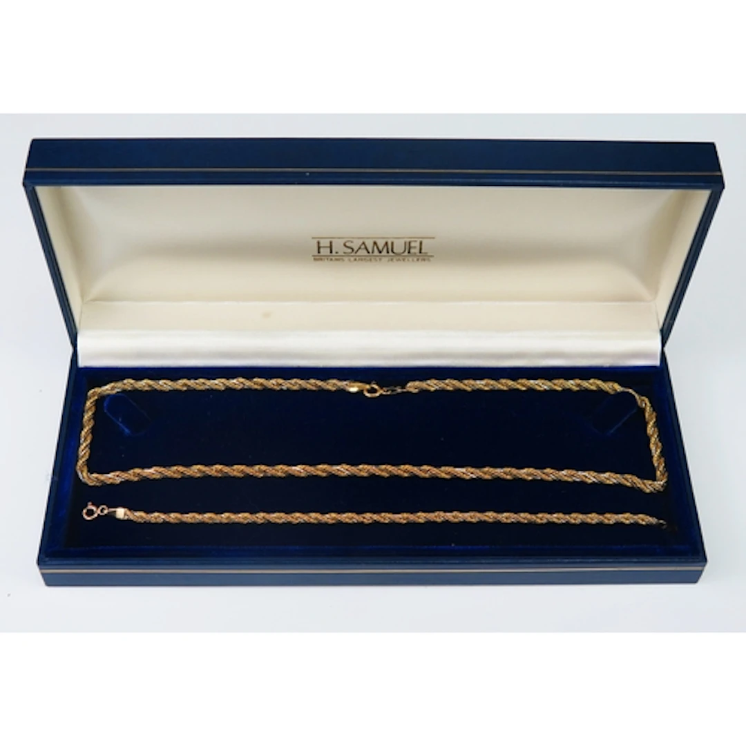 A 9ct yellow gold rope twist and white box link entwined nec...