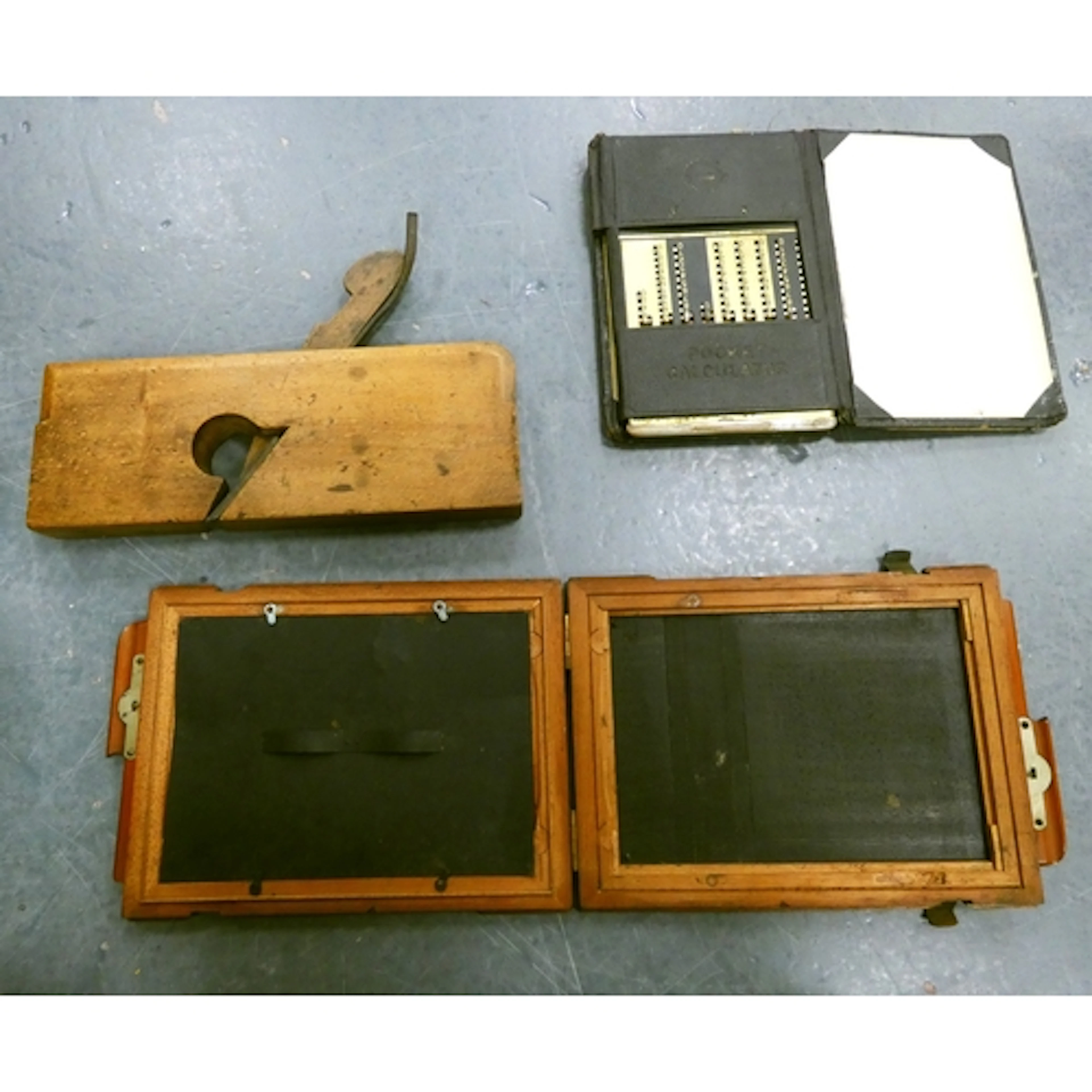 Vintage woodworking plane, pocket calculator and antique cam...