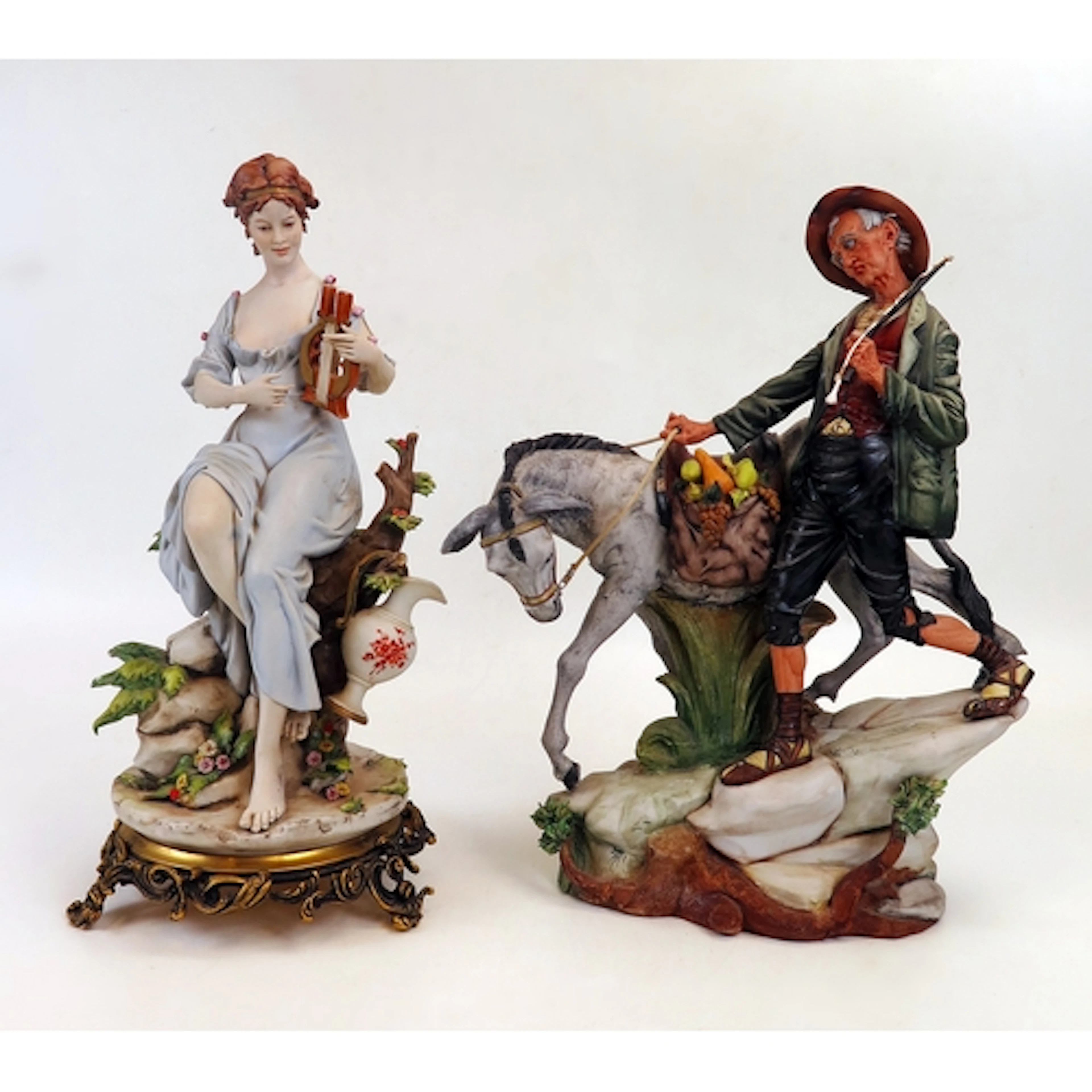 Capodimonte - two bisque porcelain figure groups, one depict...
