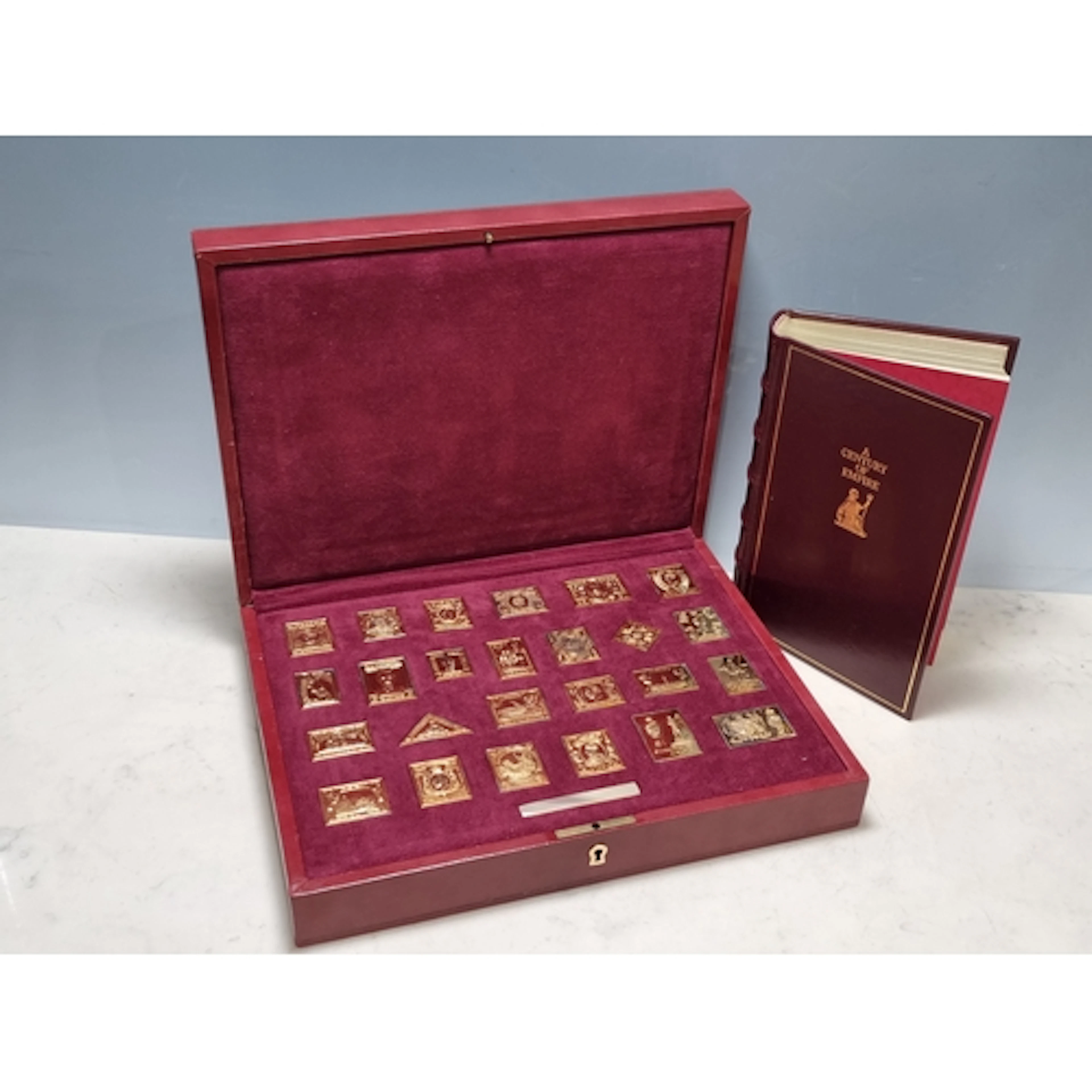 The Empire Collection, a set of 25 silver gilt Replica Stamp...