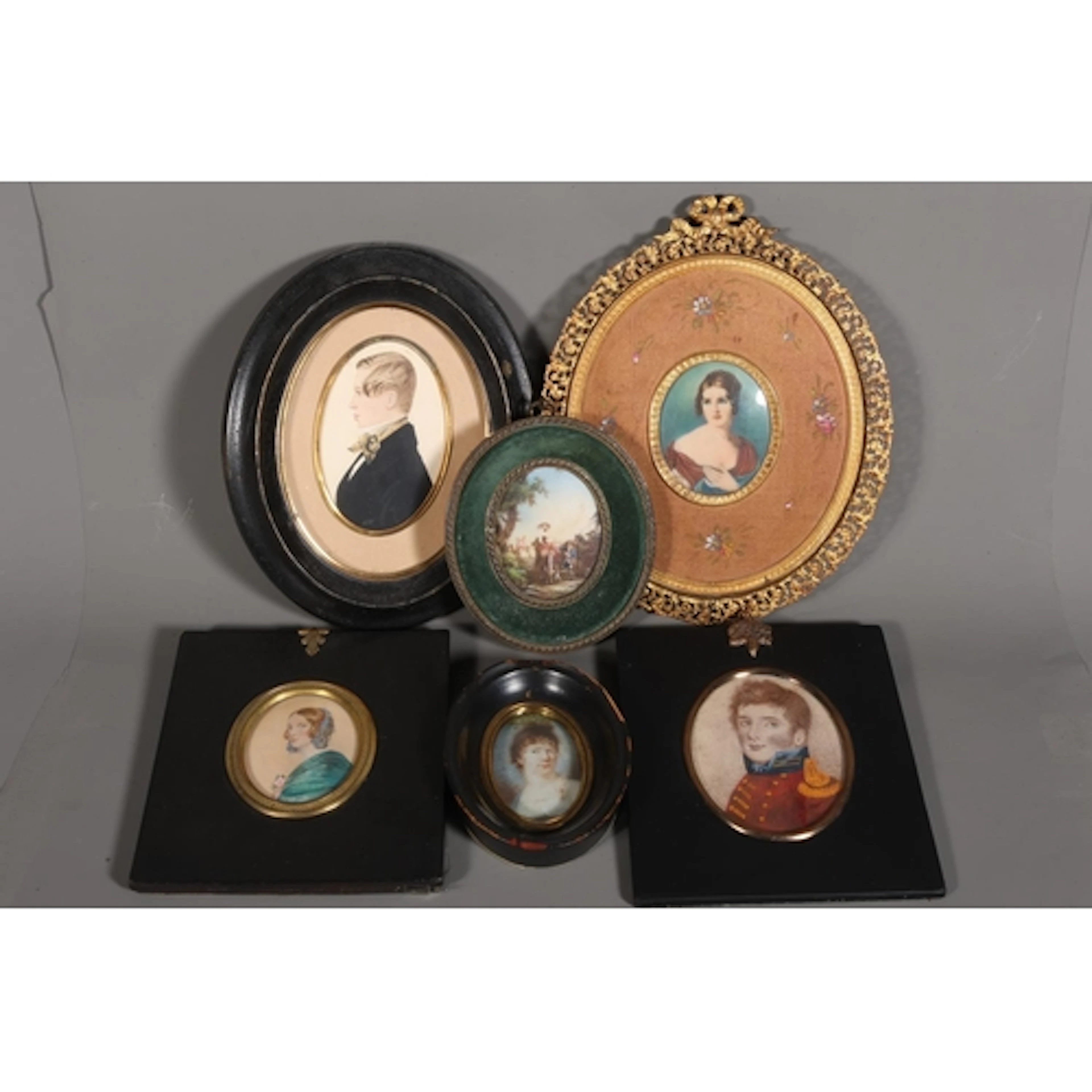 Group of six miniature portraits to include a watercolour on...