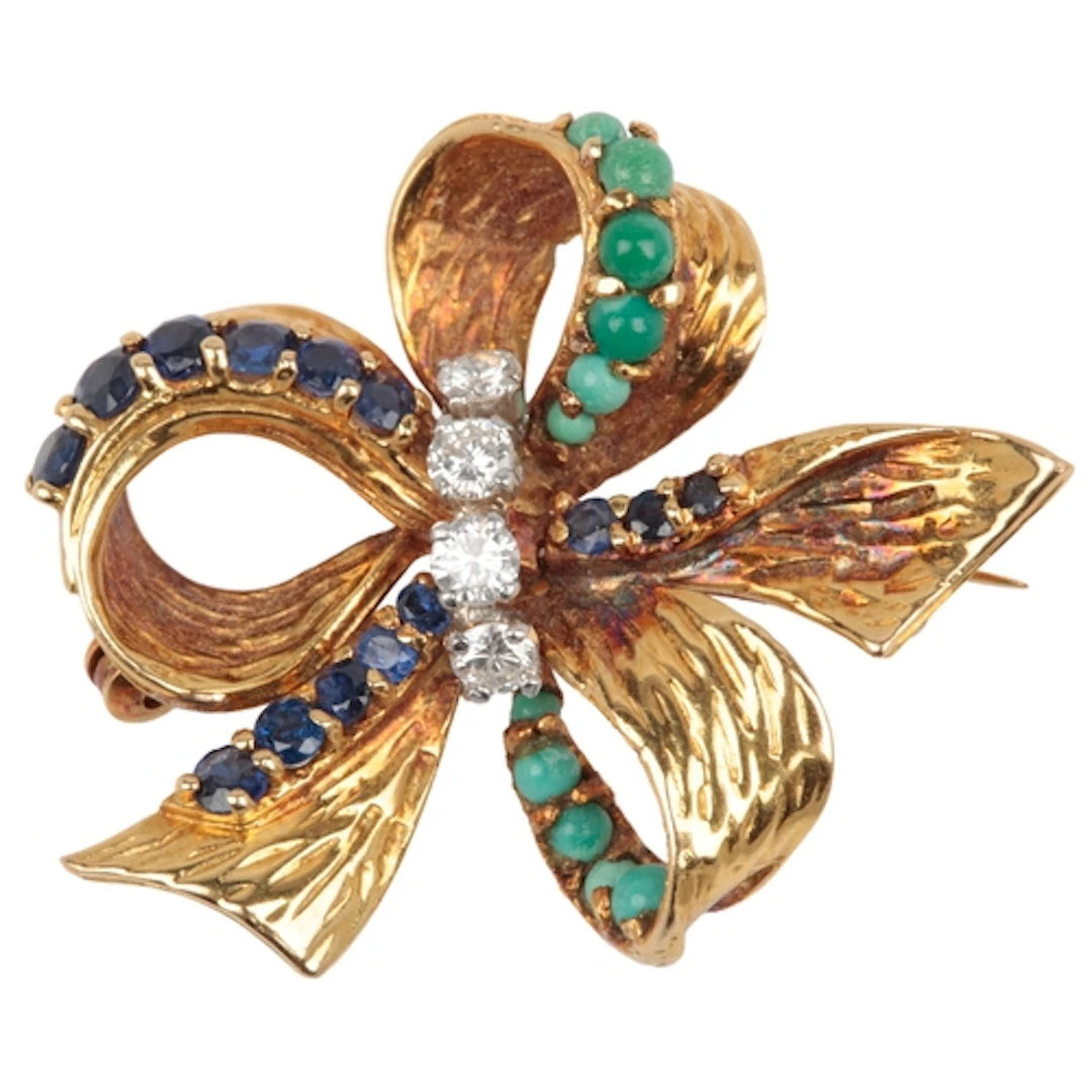 A turquoise, sapphire and diamond brooch, 1960s, designed as...