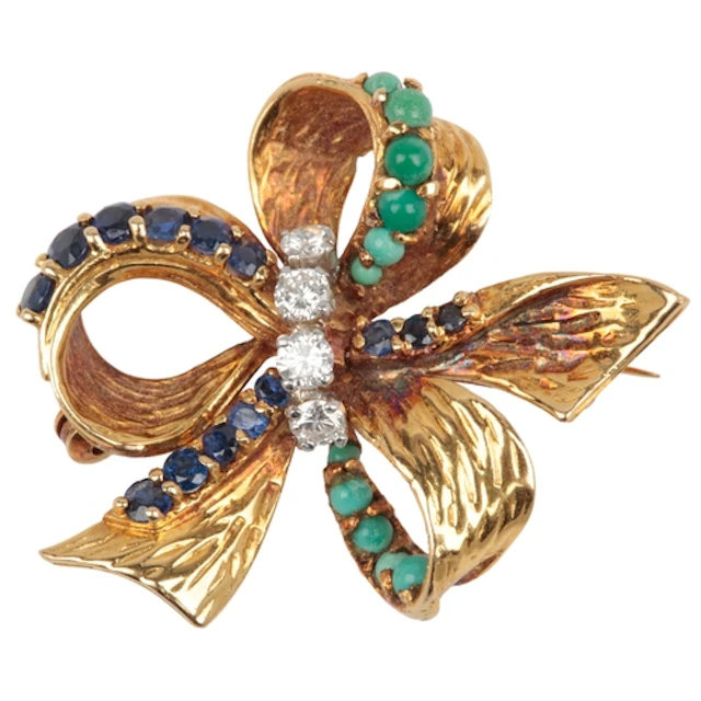 A turquoise, sapphire and diamond brooch, 1960s, designed as...