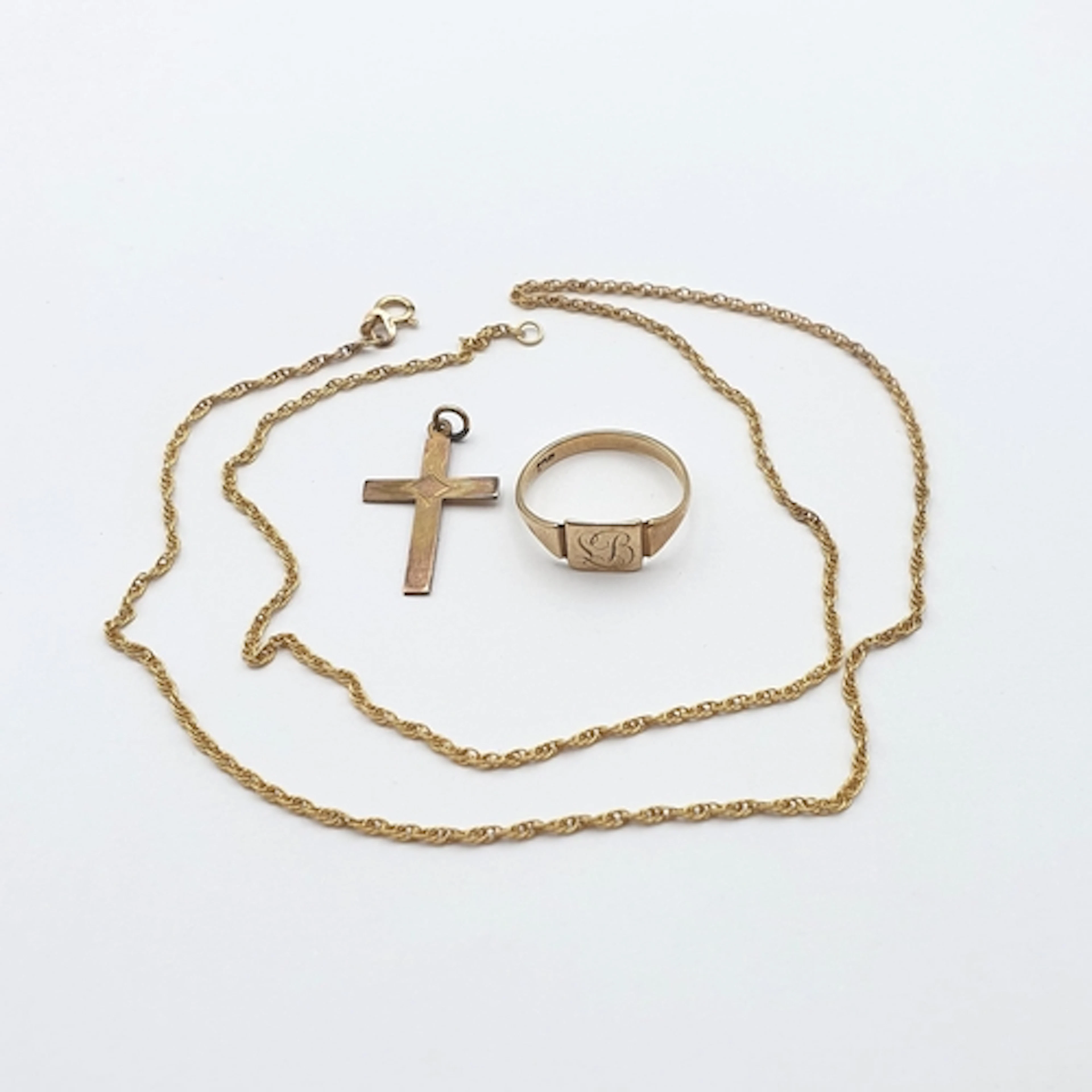 A small Pendant Cross, a Prince of Wales Chain and a Signet ...