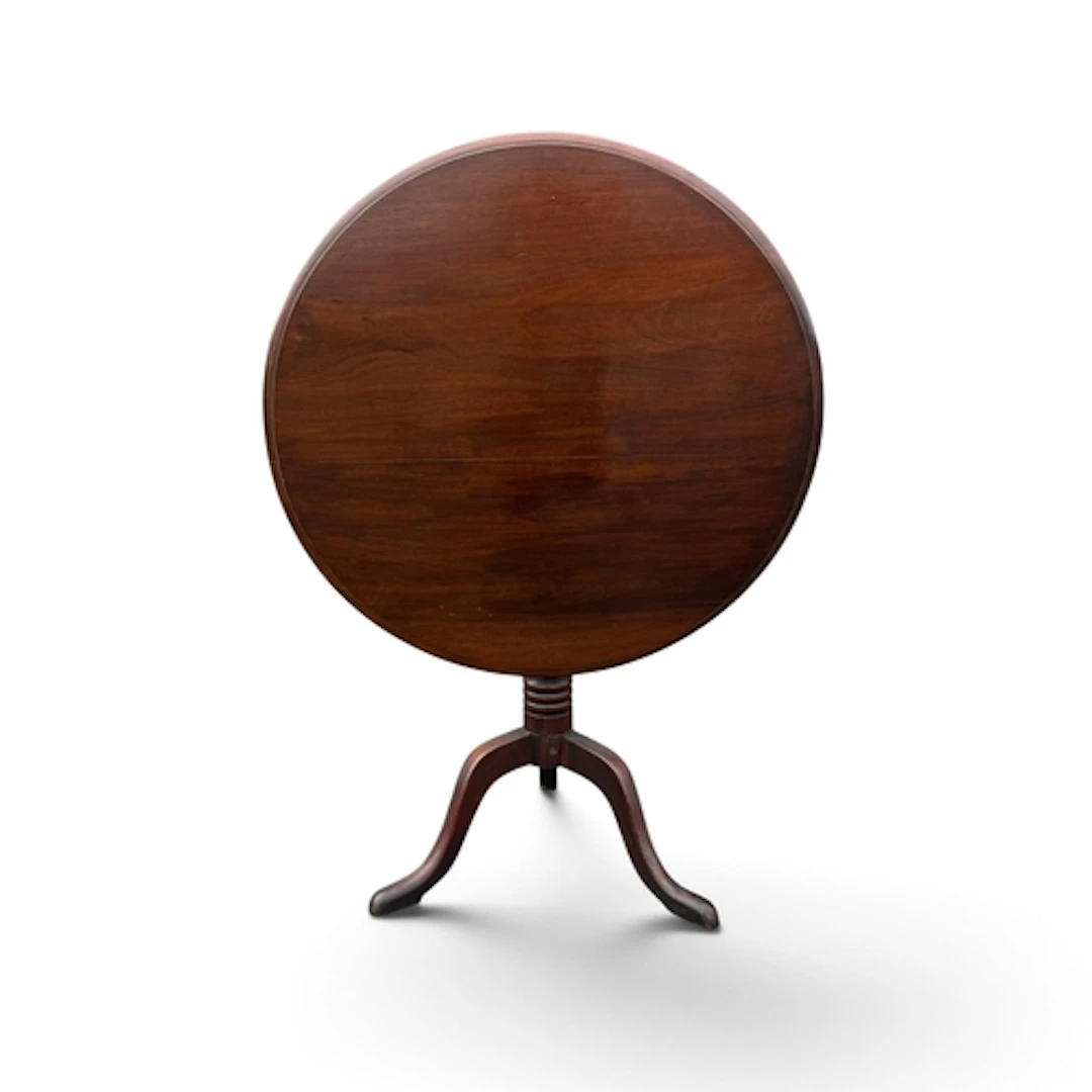A GEORGE III MAHOGANY TILT TOP PEDESTAL TABLE The circular t...