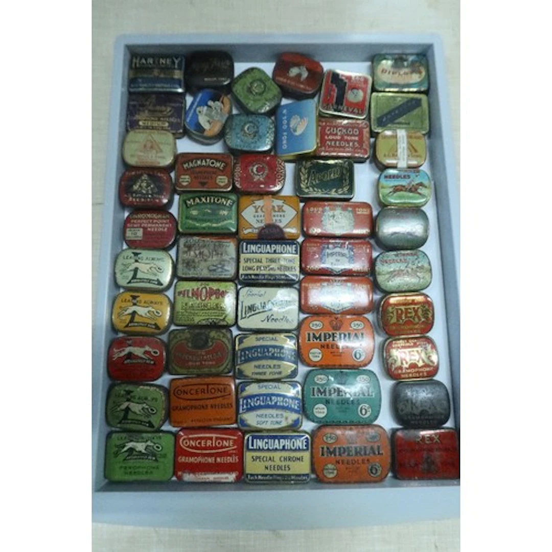 A tray of vintage gramphone needle tins