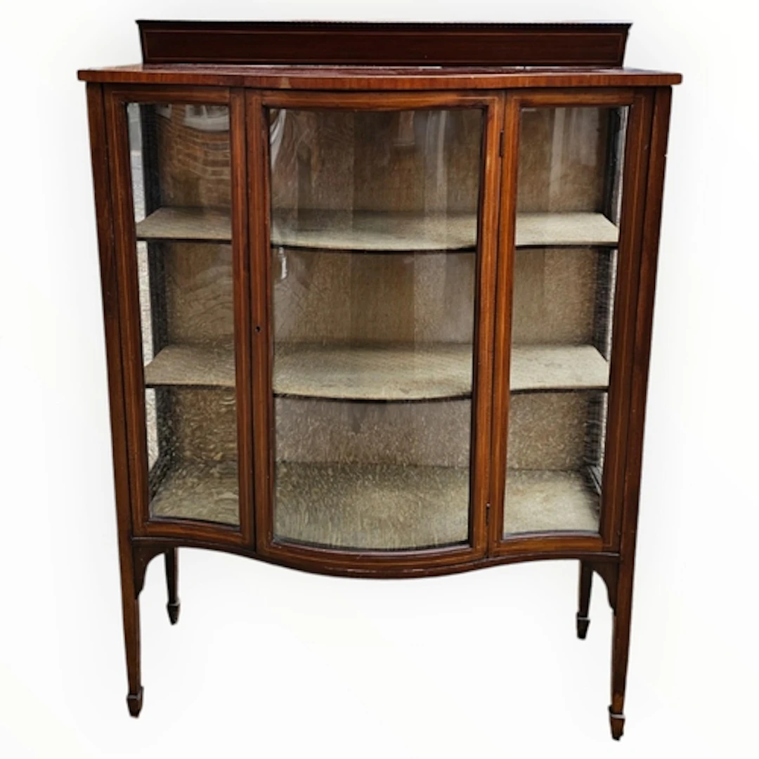 AN EDWARDIAN MAHOGANY AND SATINWOOD DISPLAY CABINET With bow...