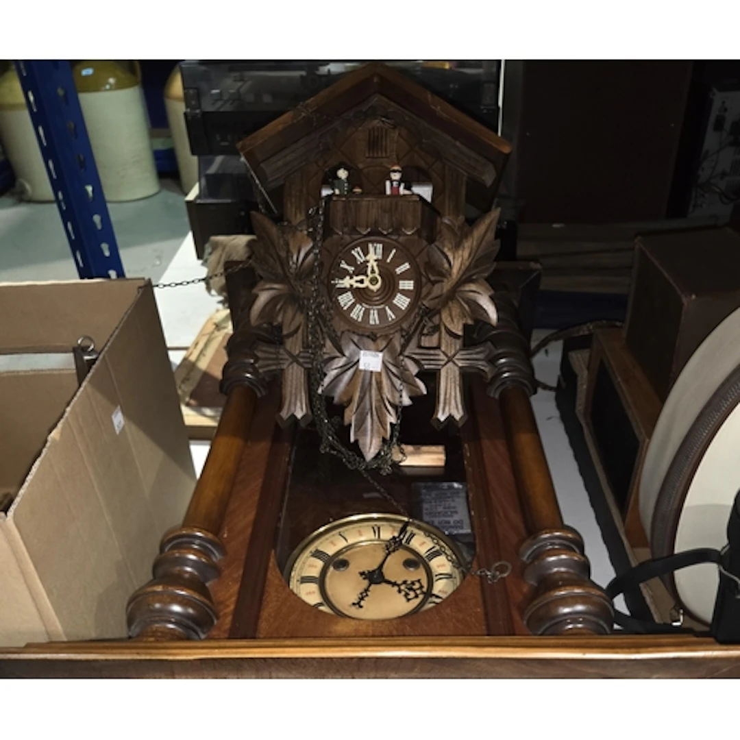 A German made cuckoo clock, a mahogany Vienna wall clock.