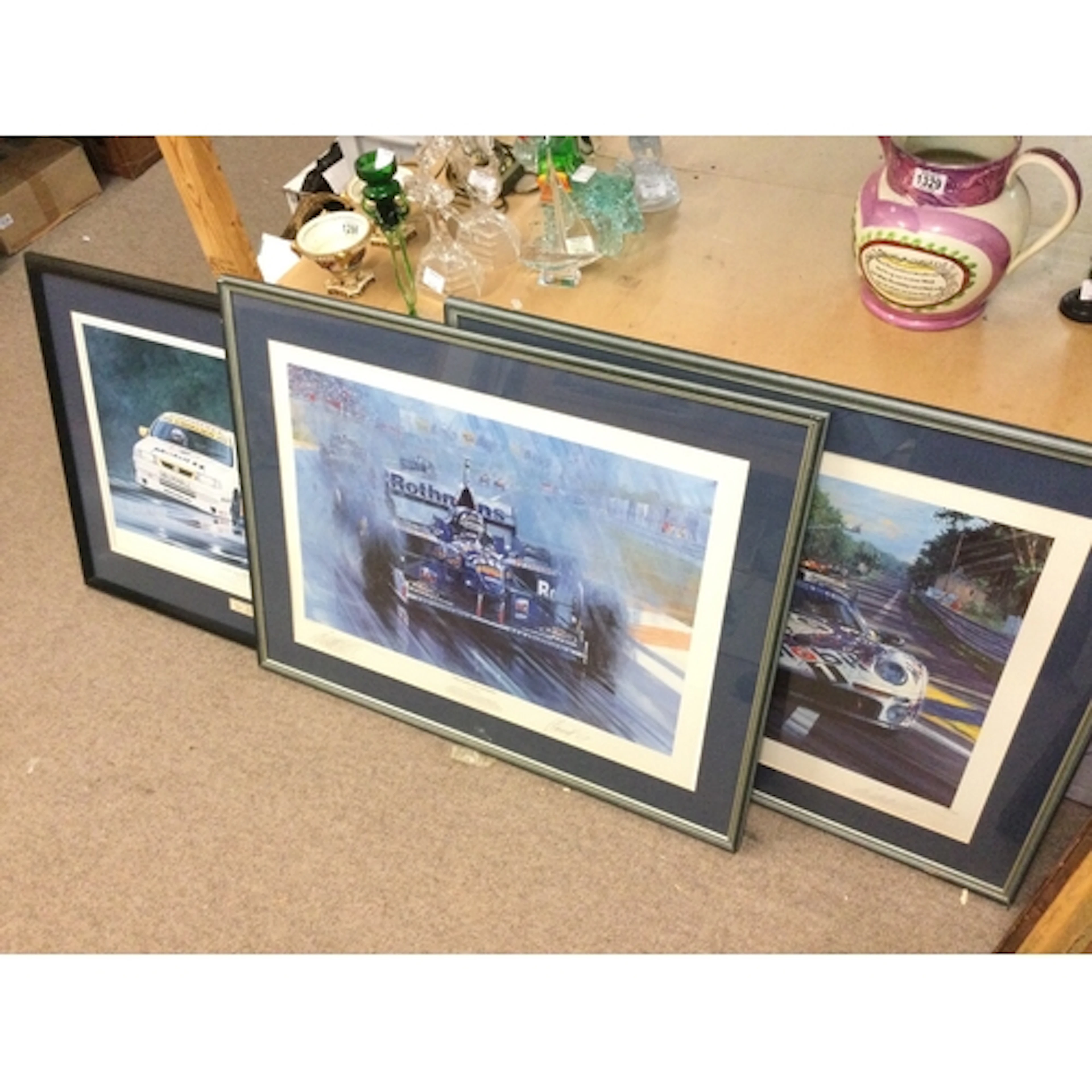 Three formula one and Le Mans signed racing prints. Frame di...