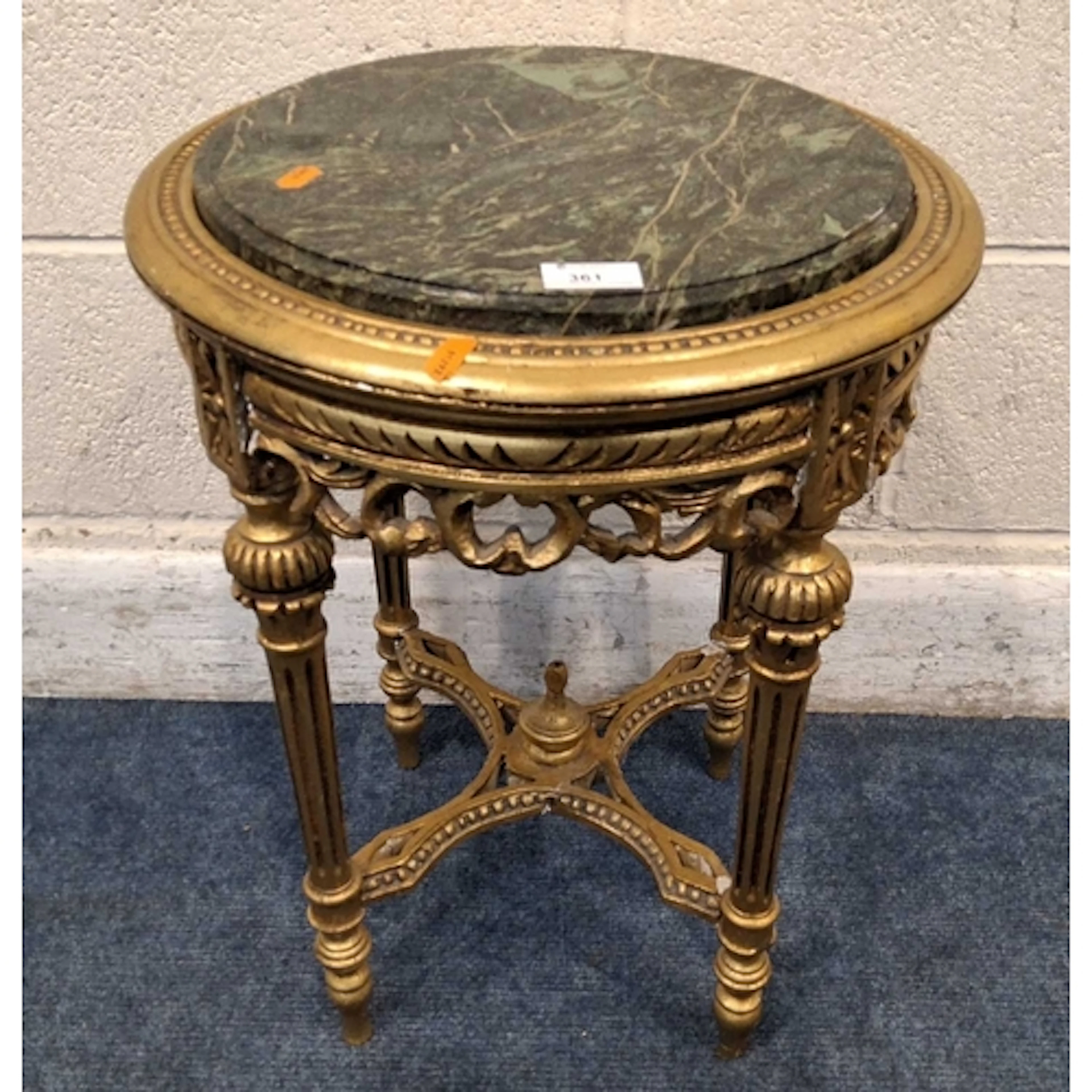 A GILT WOOD OCCASIONAL TABLE, with a green marble insert, ra...