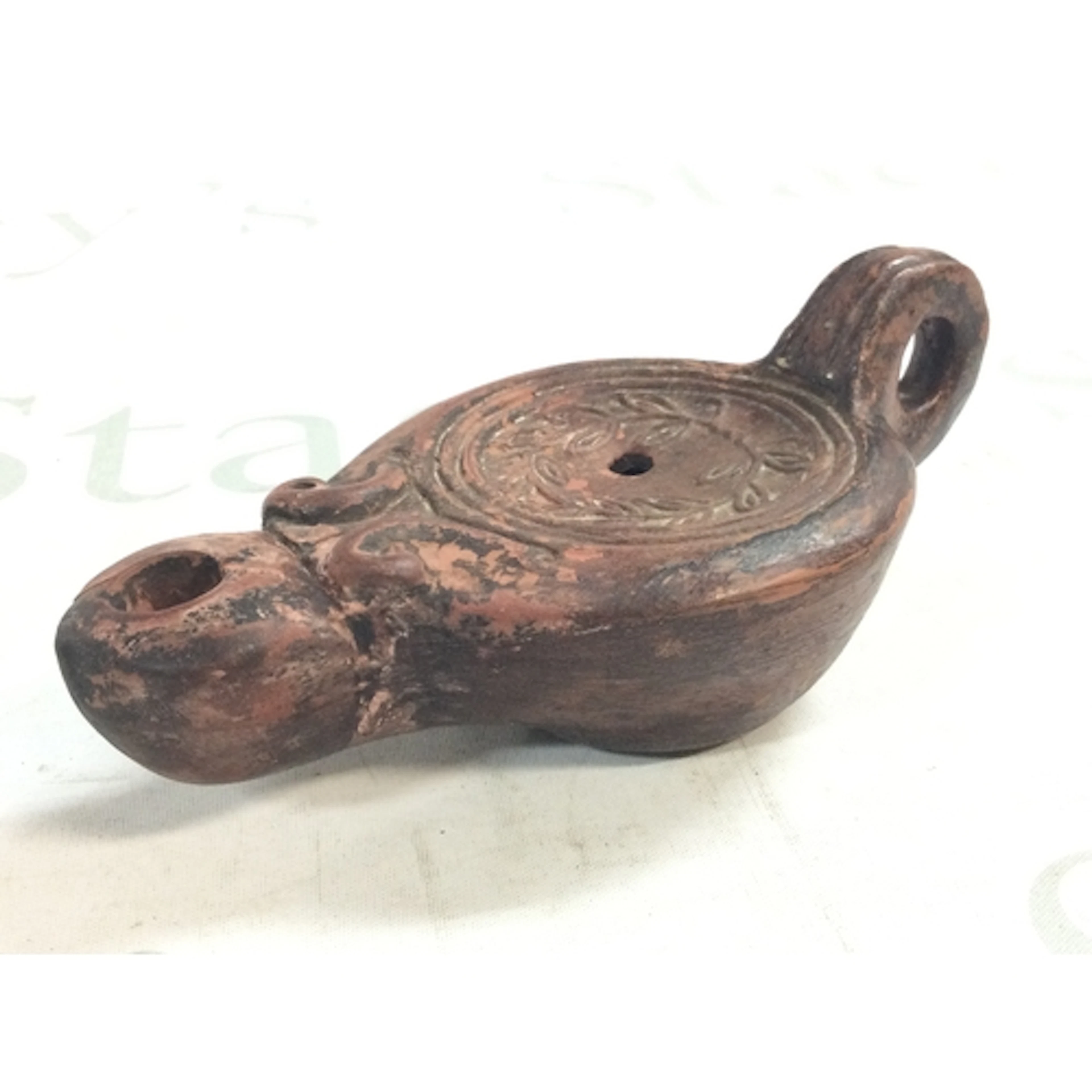 An Ancient Egyptian lamp, 16cm long