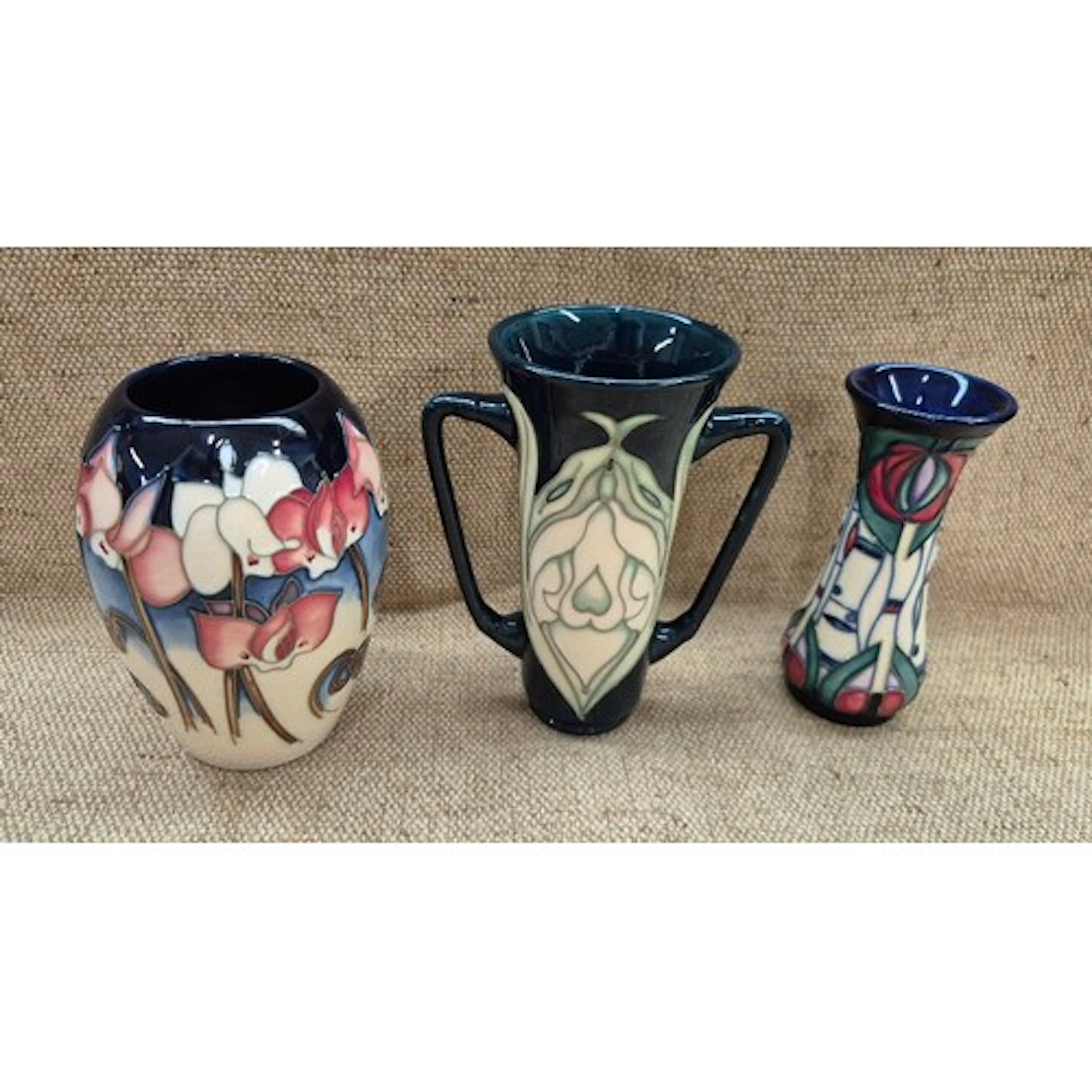 3 pieces Moorcroft pottery. Vase in Wild Cyclamen pattern, 1...