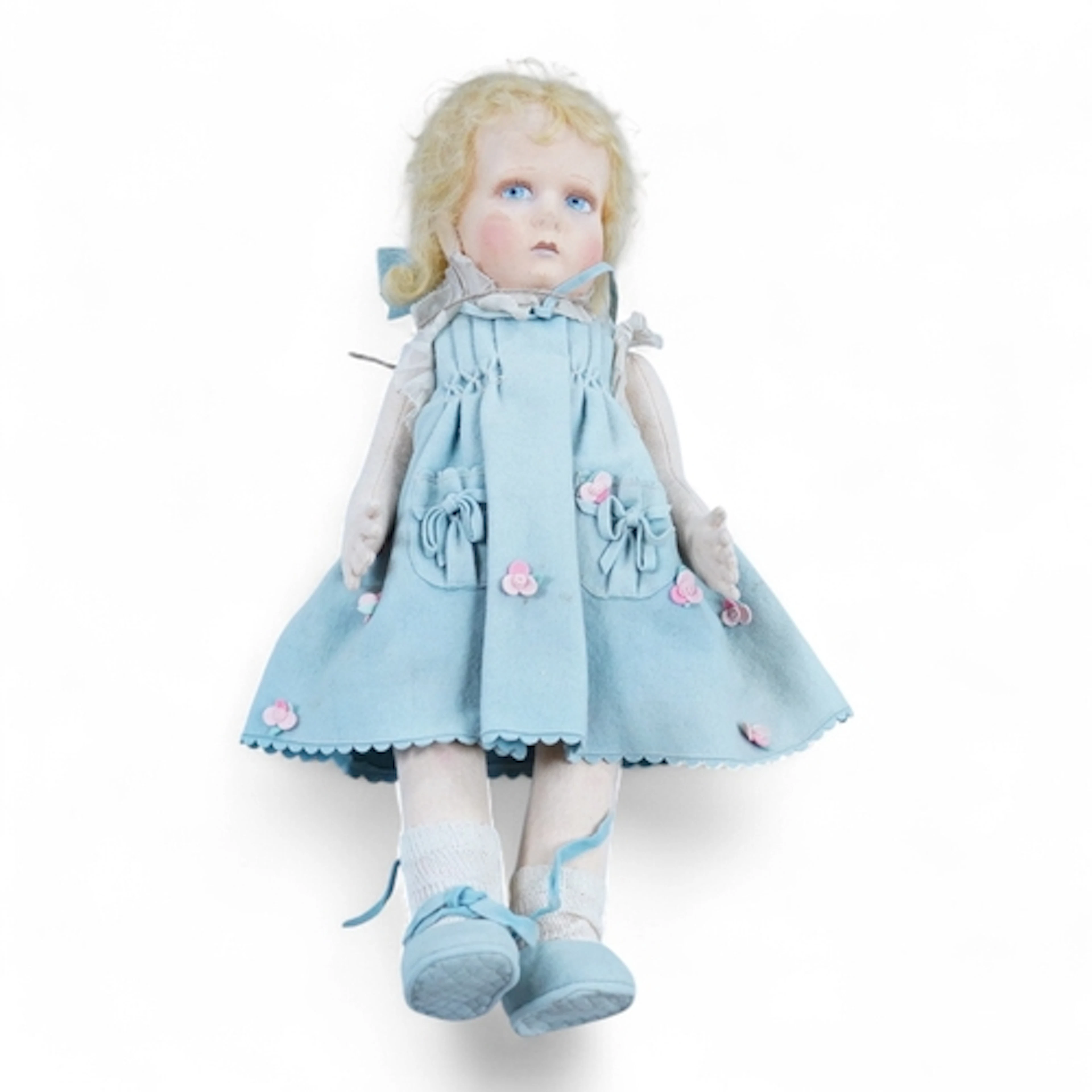 A wool felt Lenci doll with painted features to the face, 42...