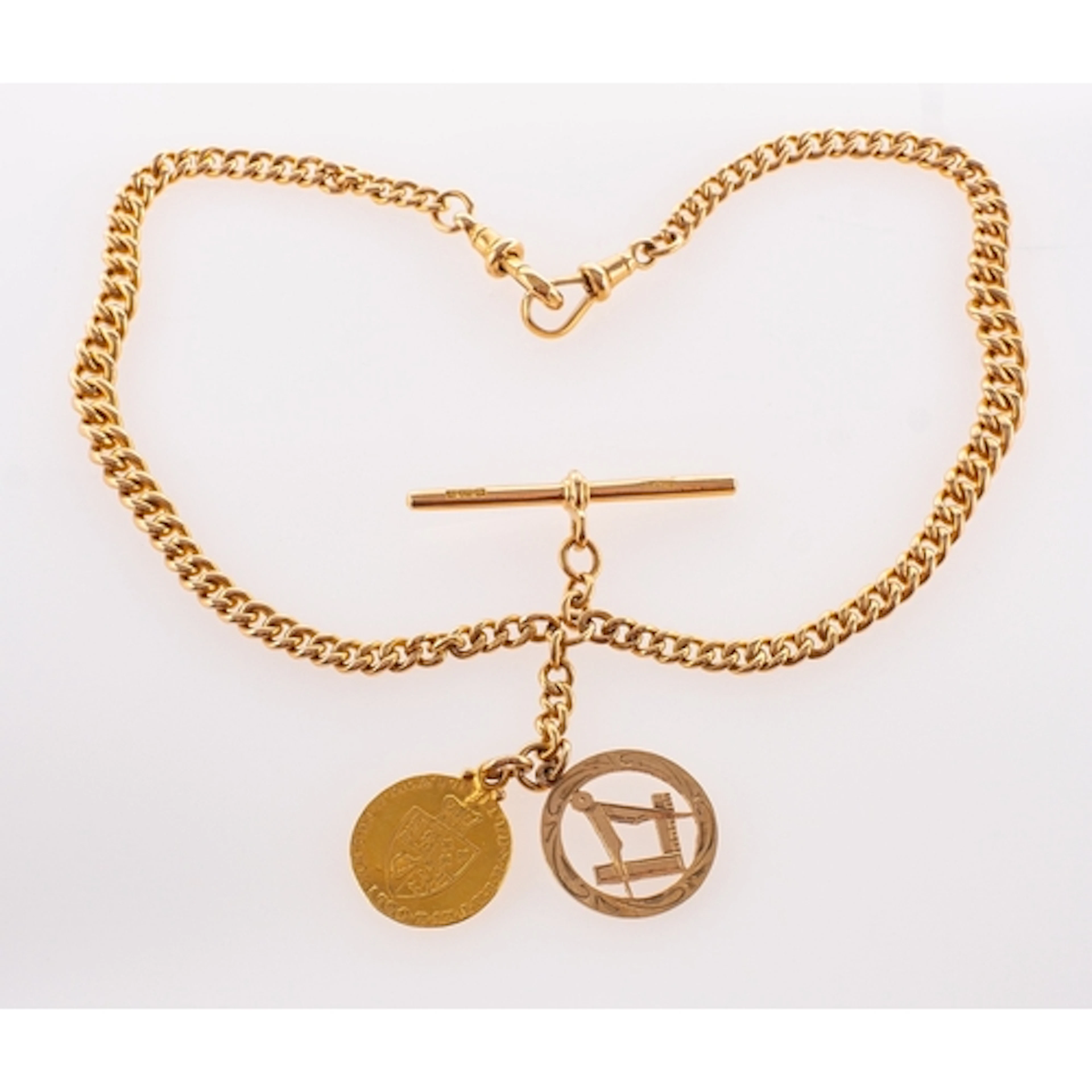 An 18ct gold watch chain with George III half spade guinea a...