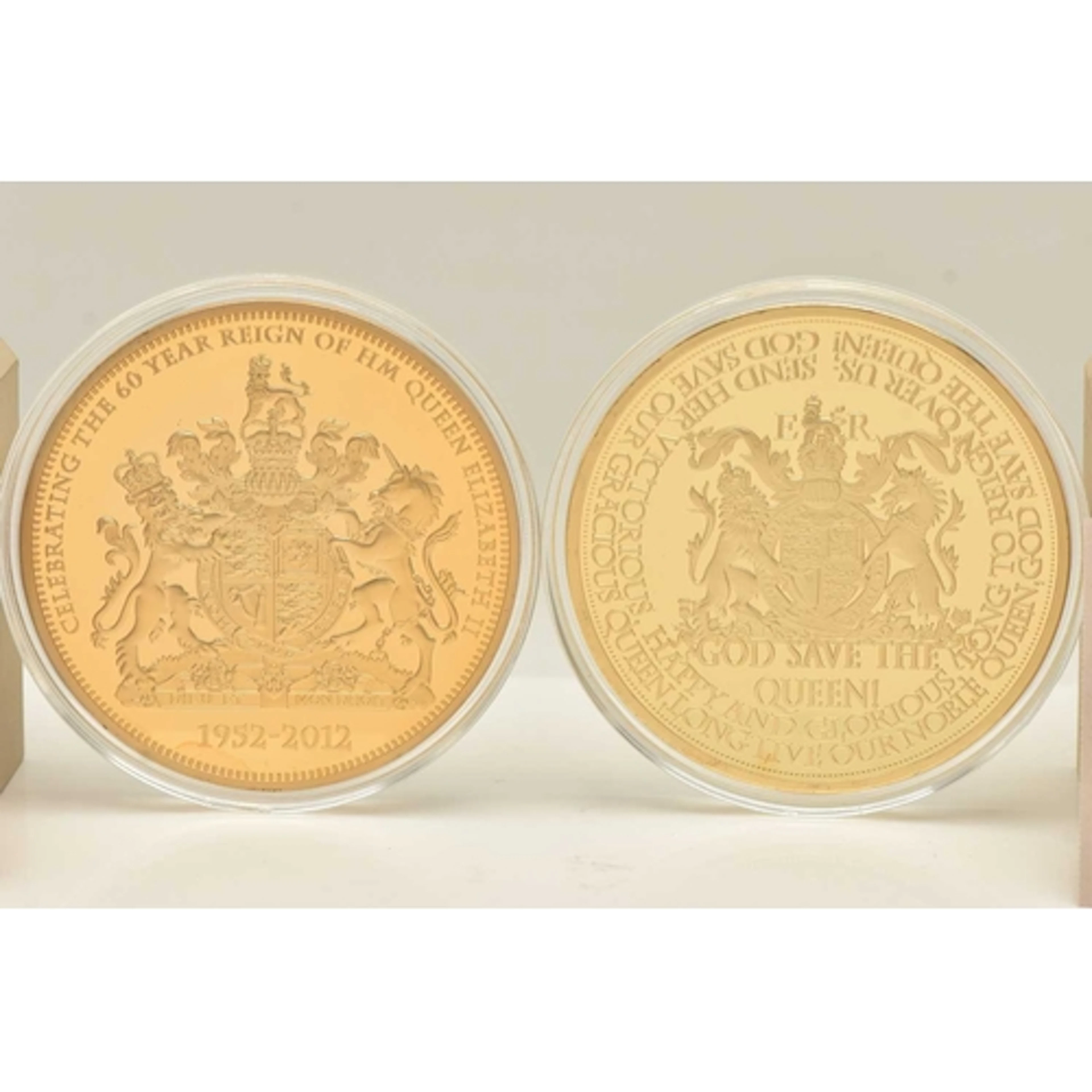 TWO GOLD PLATED LARGE COMMEMORATIVE QUEEN ELIZABETH II COINS...
