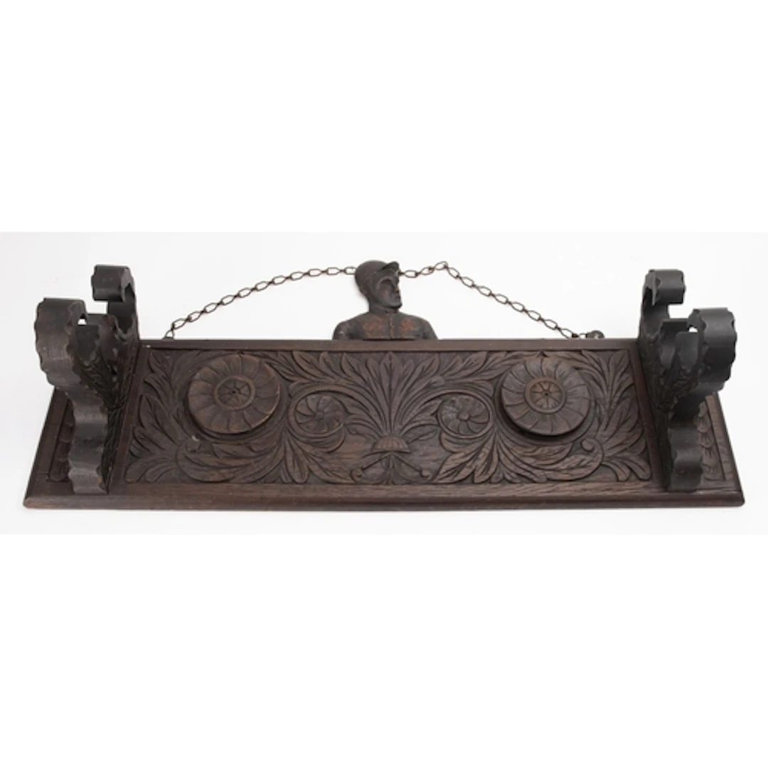 An early 20th century carved oak wall hanging riding crop st...
