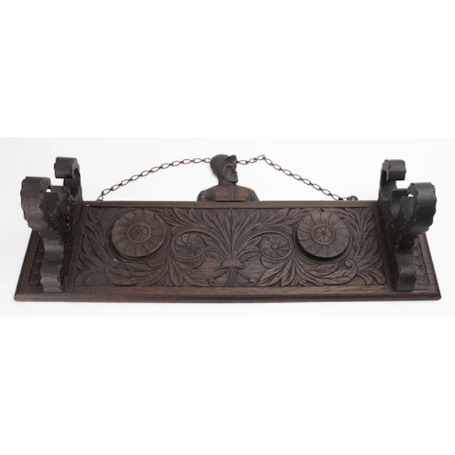 An early 20th century carved oak wall hanging riding crop st...