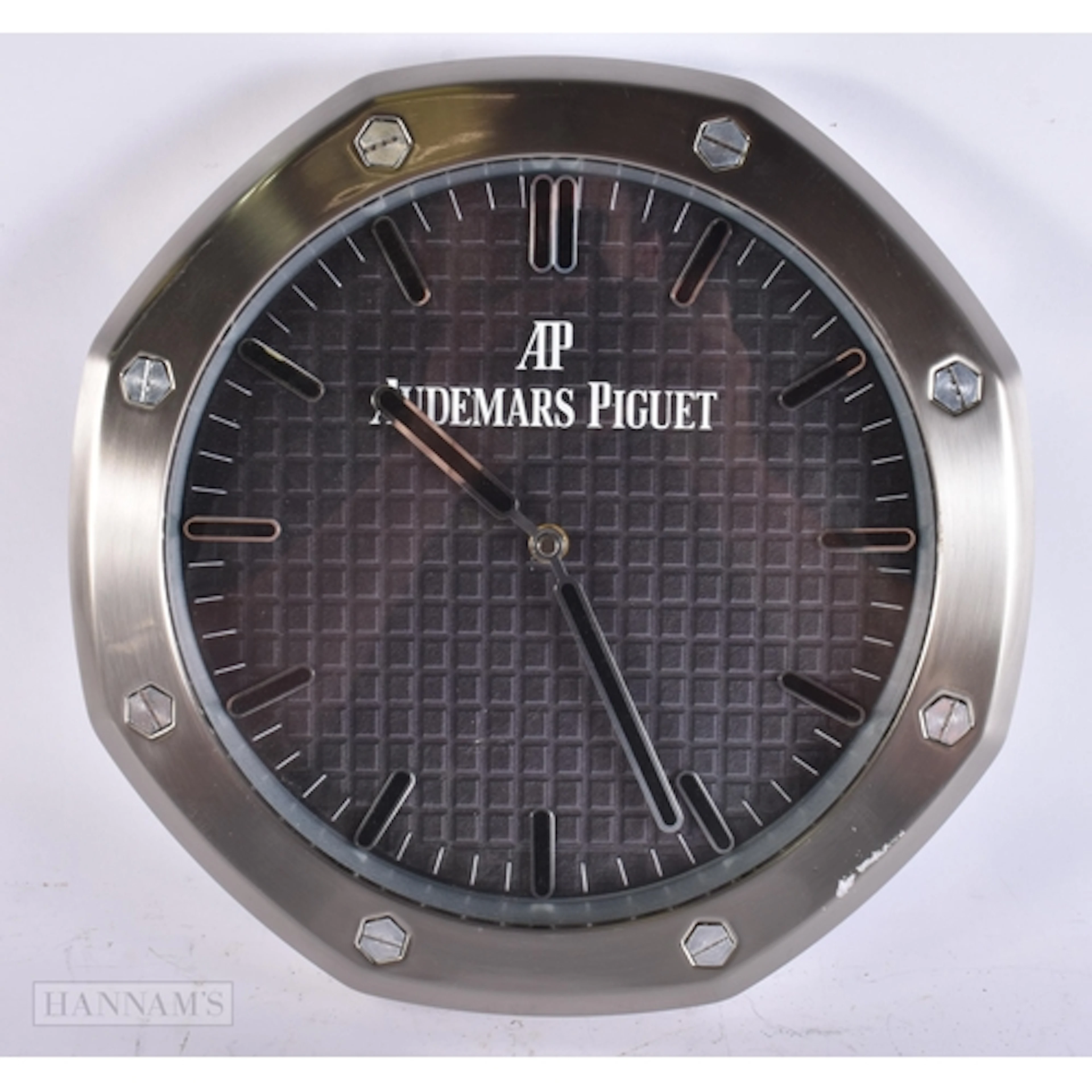 AN AUDEMARS PIGUET WALL CLOCK. 34 cm wide.