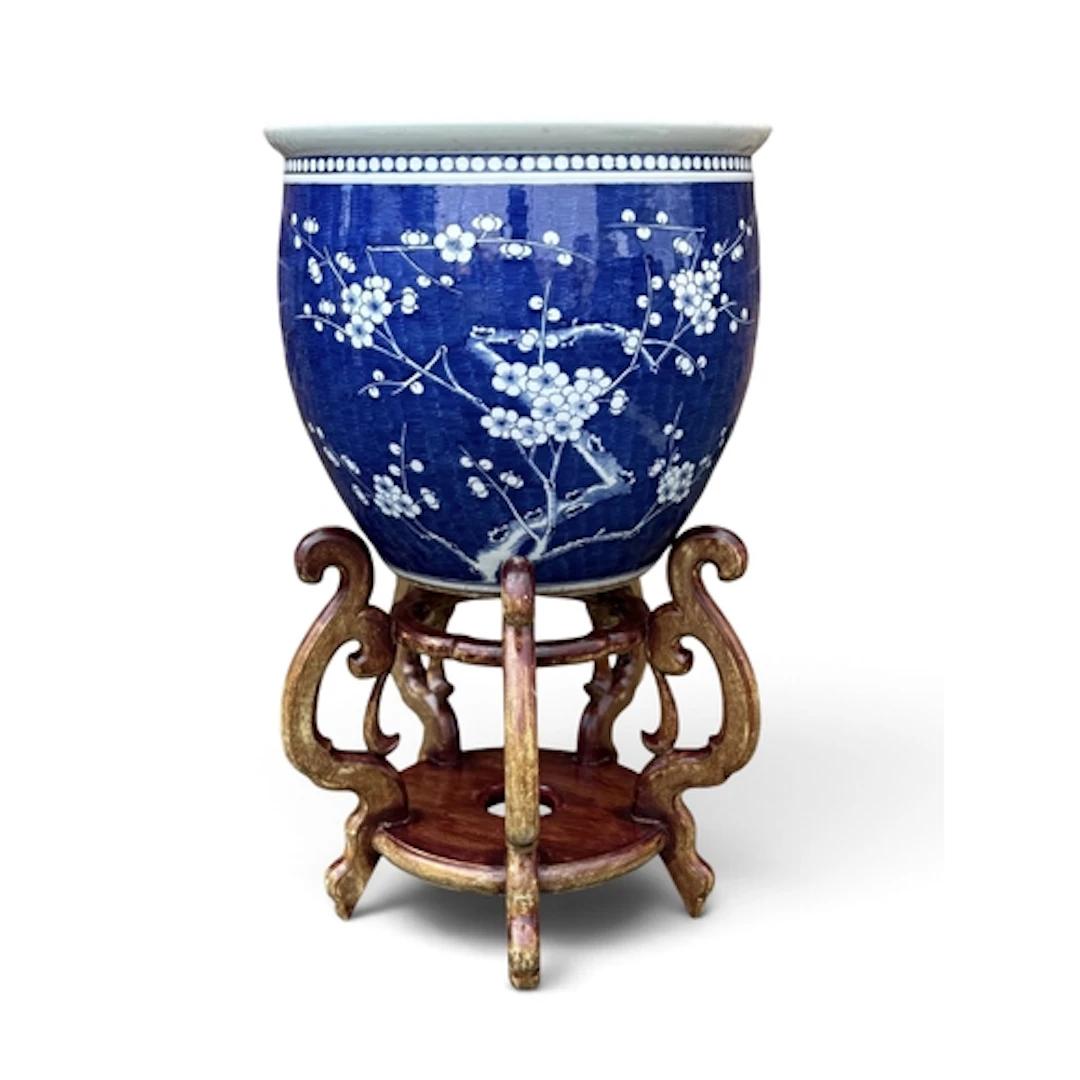 A CHINESE 20TH CENTURY 'PRUNUS' JARDINIERE On a hardwood sta...