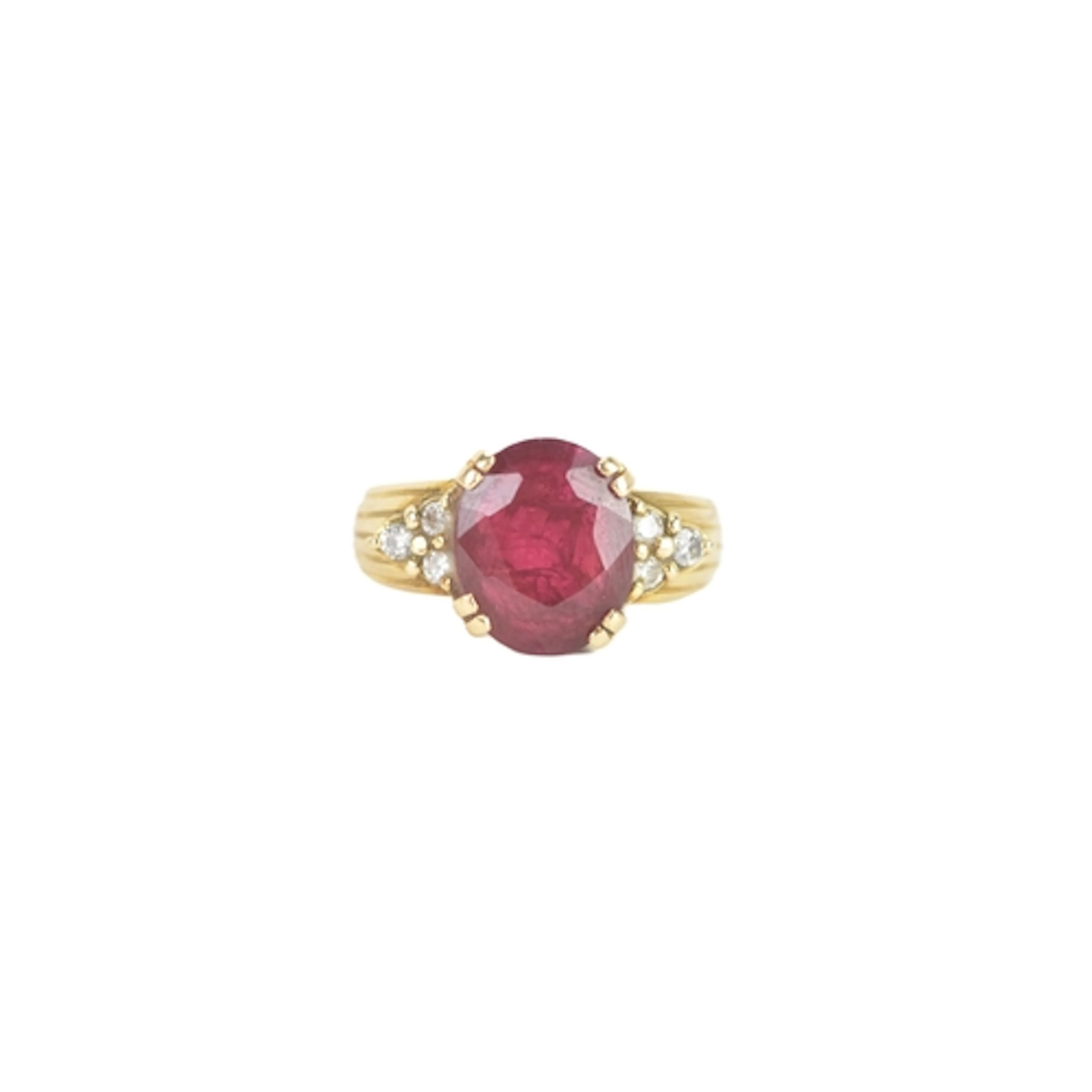 A ruby and diamond 18ct gold ring, the oval ruby in a four c...