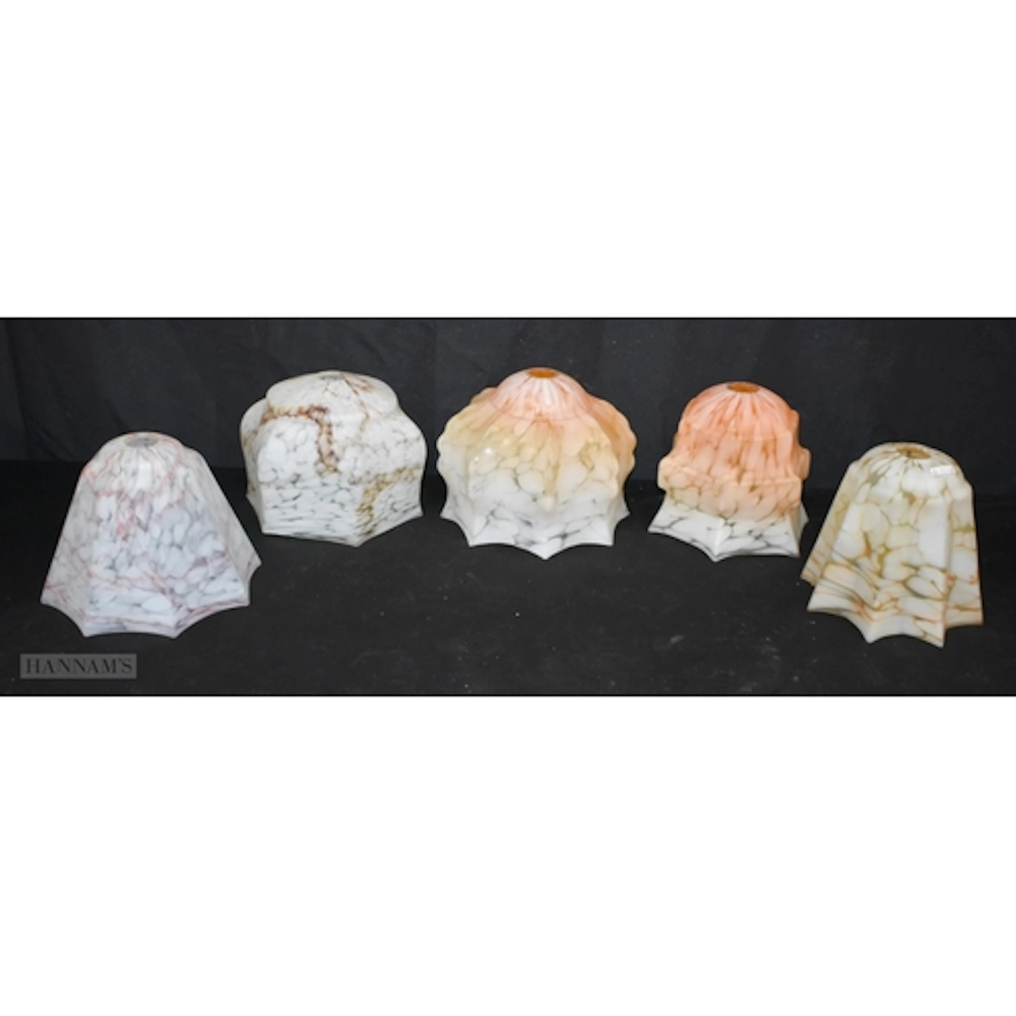 A collection of vintage Art Deco style marbled glass lampsha...