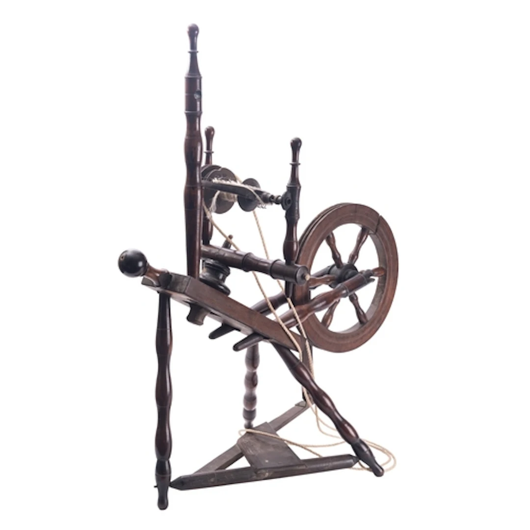 A Regency oak and walnut spinning wheel, early 19th century;...