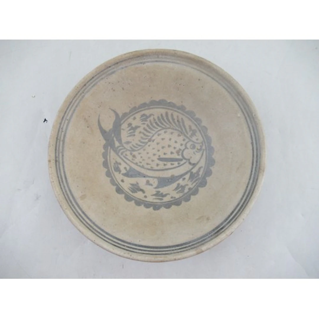 A Thai pottery bowl, decorated with a fish, diameter 10ins, ...