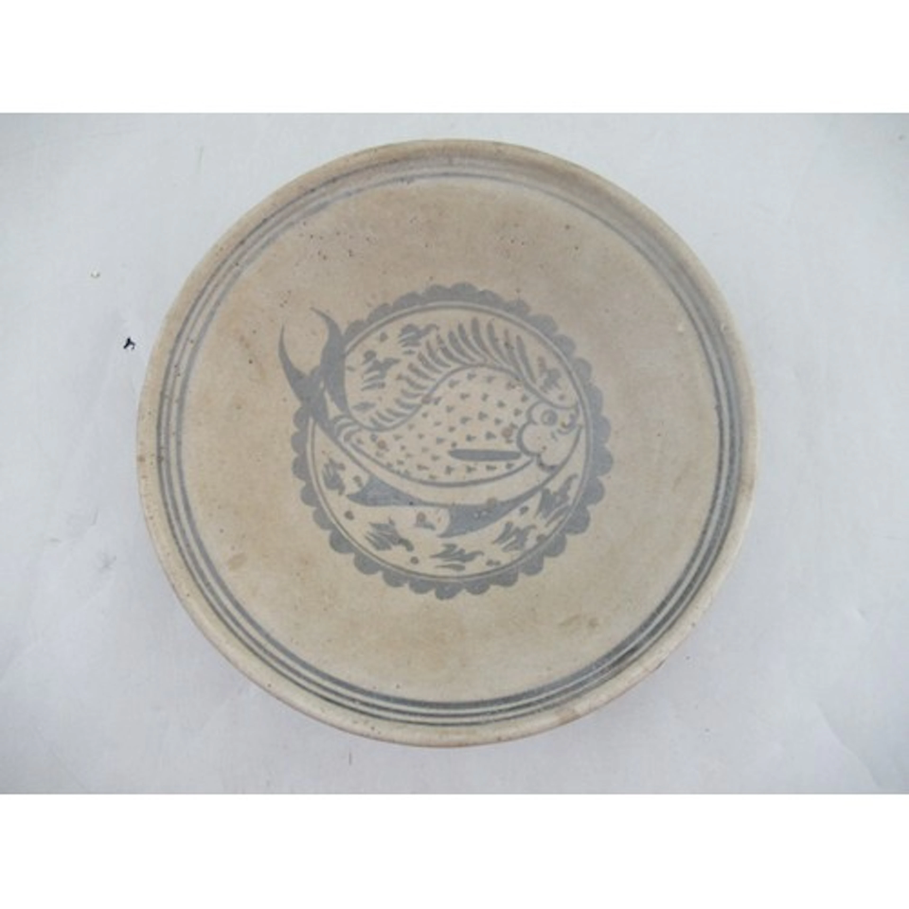 A Thai pottery bowl, decorated with a fish, diameter 10ins, ...