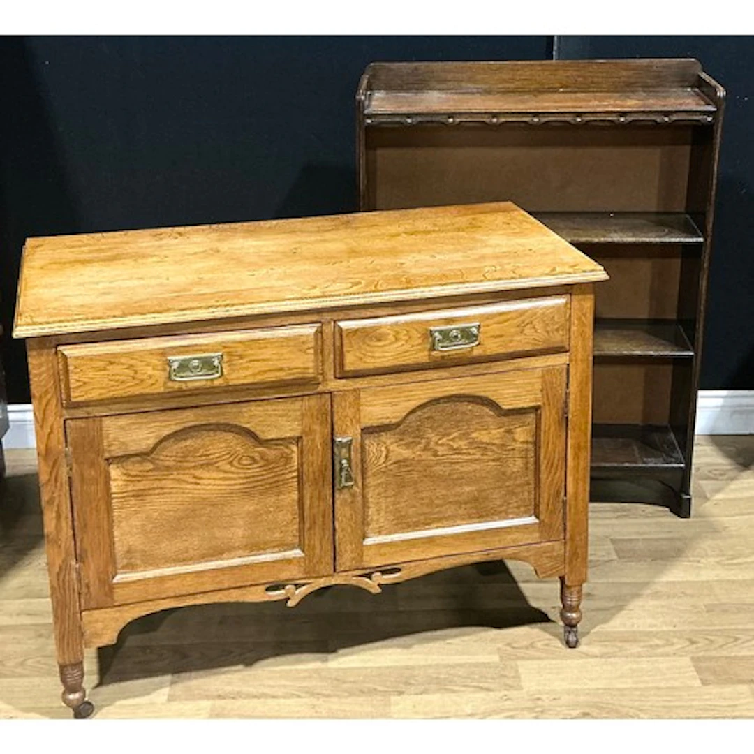 An Arts & Crafts oak side cabinet, 77.5cm high, 103cm wide, ...
