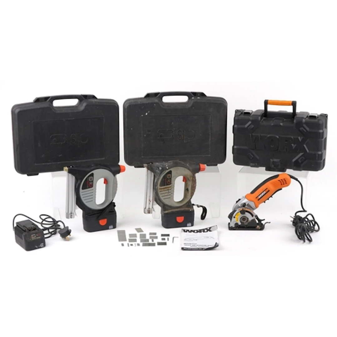 Two SIP nail guns and a Worx angle grinder, each with hard p...