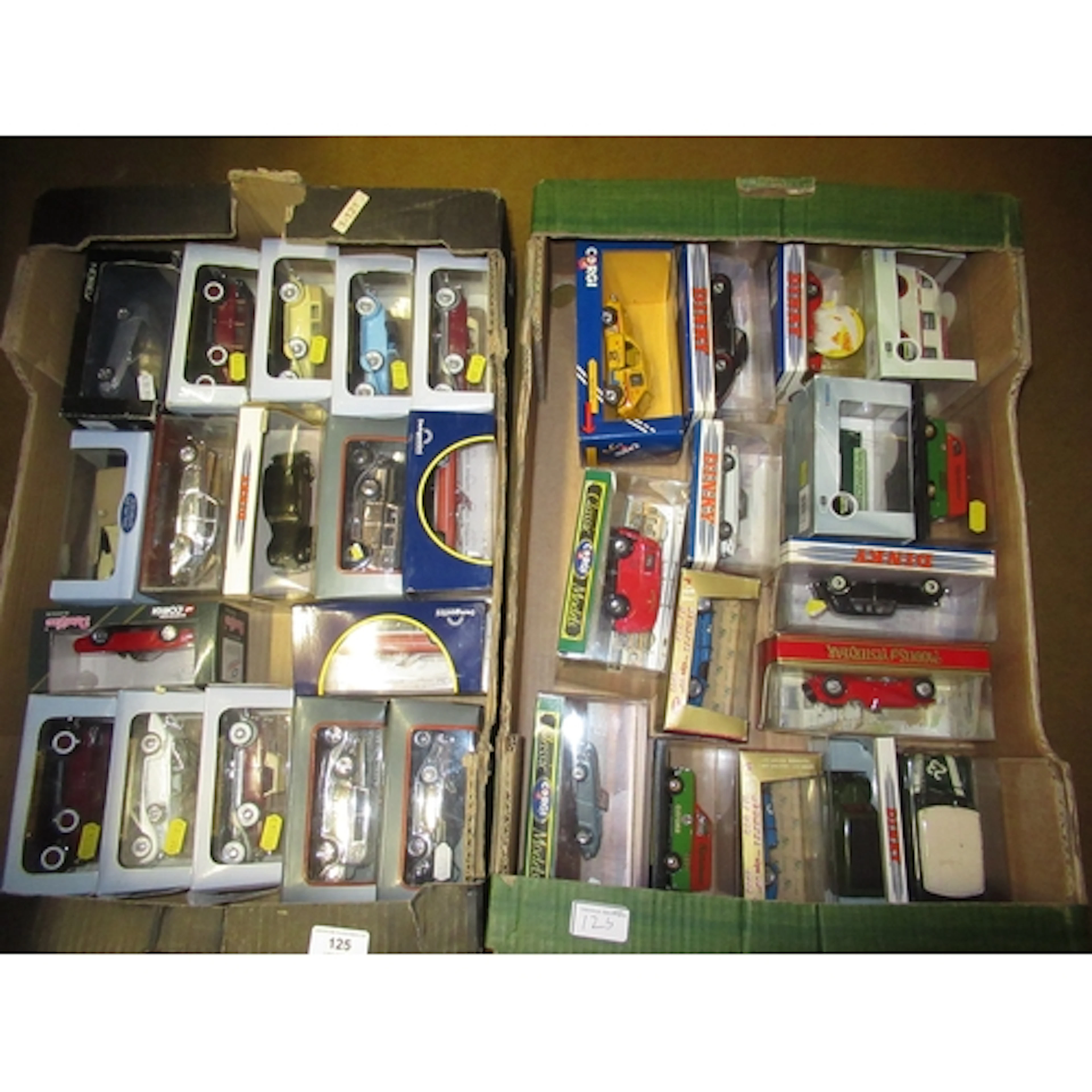 Two boxes containing a quantity of boxed diecast metal model...