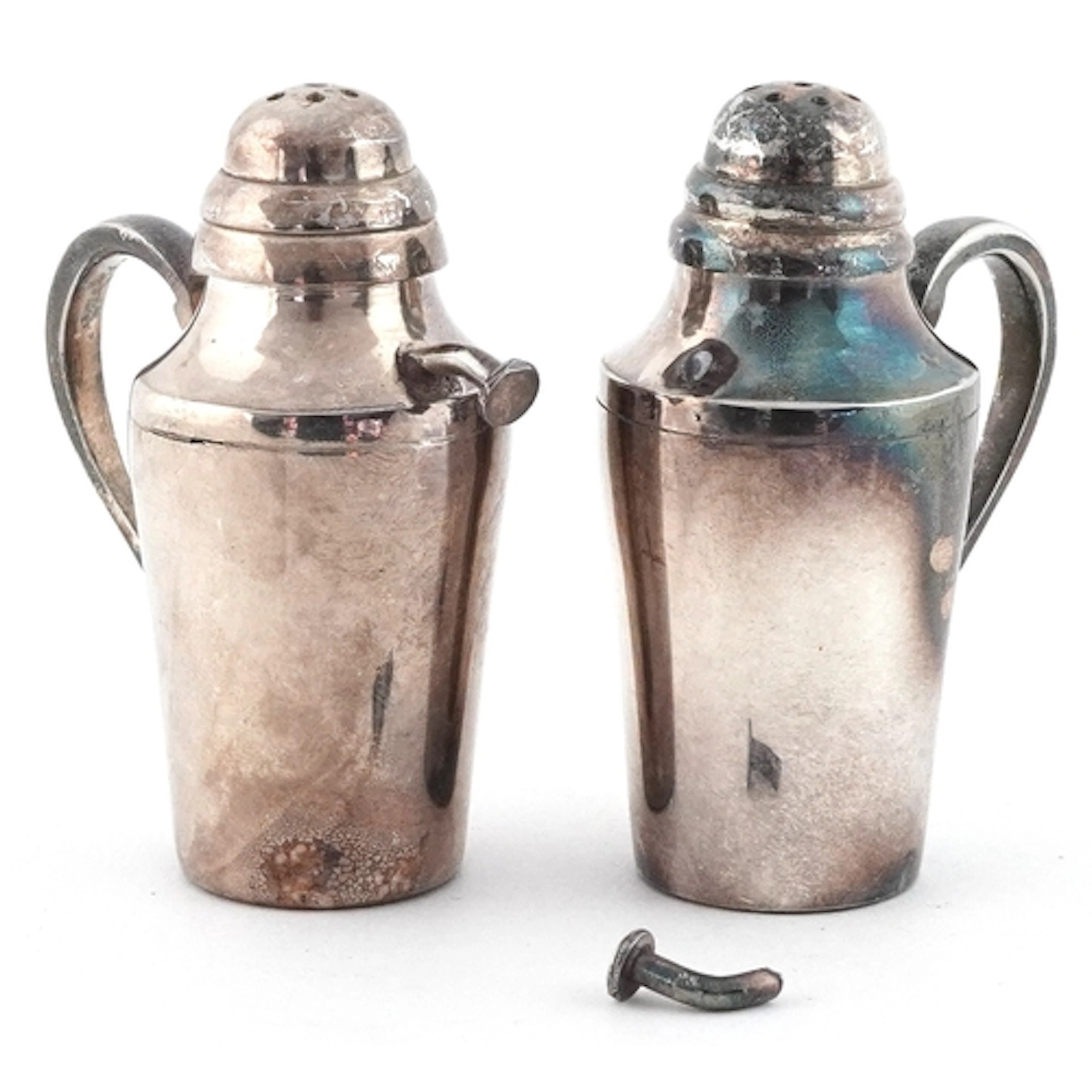 Pair of silver plated salt and pepper shakers in the form of...